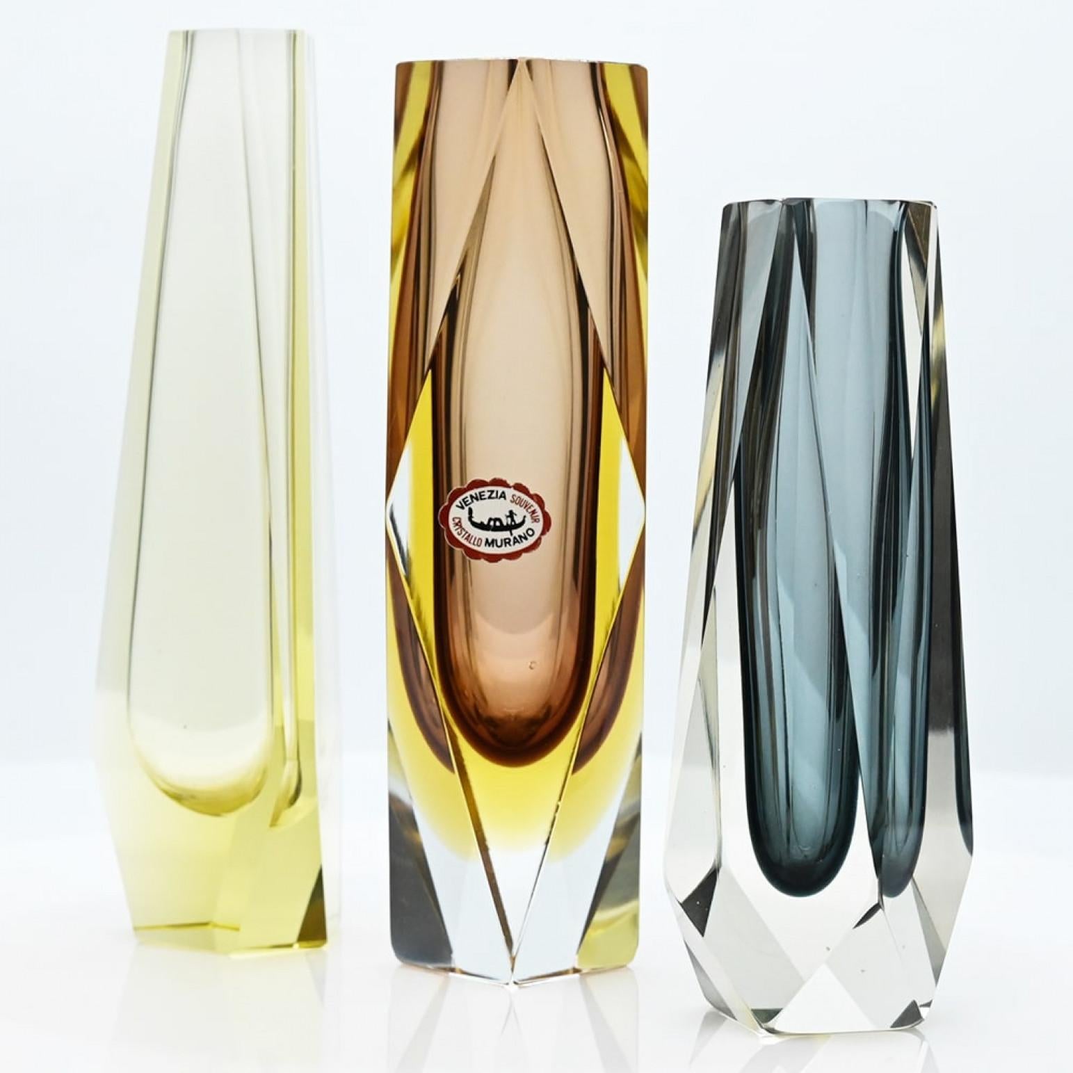 Set of 3 Murano hand-blown vases in range of degree brown, grey, amber and yellow. The vases are made in Murano glass by the Italian artist glassblower Mandruzzato, Italy, 1970s.

These exquisite Venetian vases are made with one of the most common