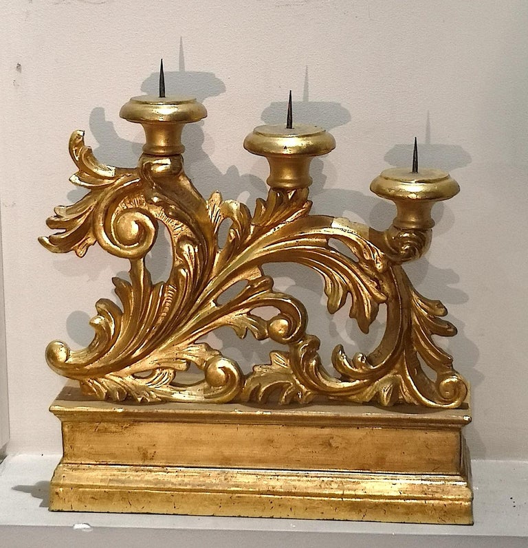 A beautiful and elegant set of 3 Italian Florentine candelabra in Mecca carved wood and gilt silver dating from the mid to end of the 18th century. They are Louis XVI in style. The gilding technique is known as 