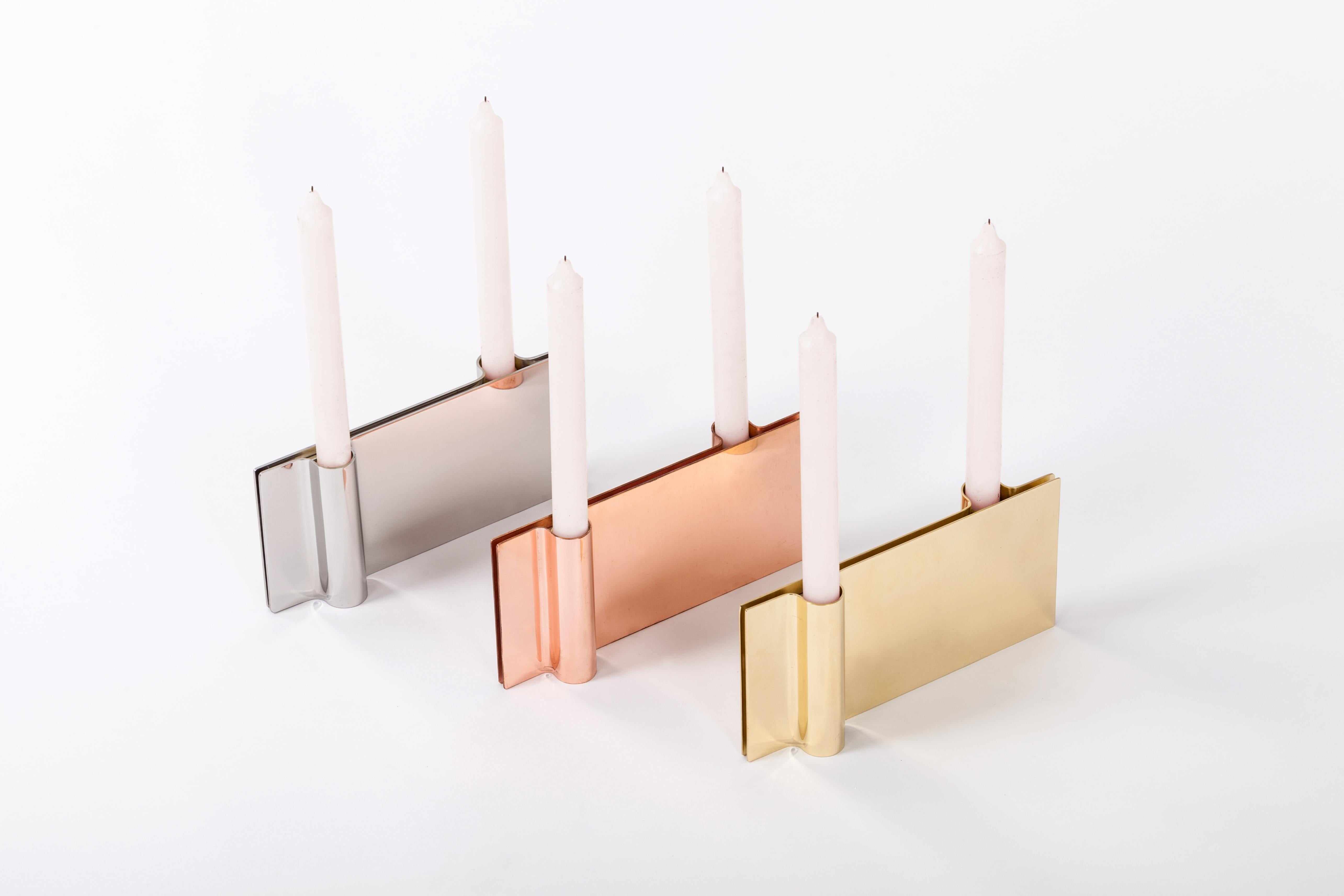 Set of 3 Folio Candle Holders by Mingardo
Dimensions: D22.5 x W2.2 x H11 cm 
Materials: Polished natural copper, Polished natural brass, Polished natural stainless steel.
Weight: 4.5 kg

Folio is a modern candle’s holder, very minimalistic in