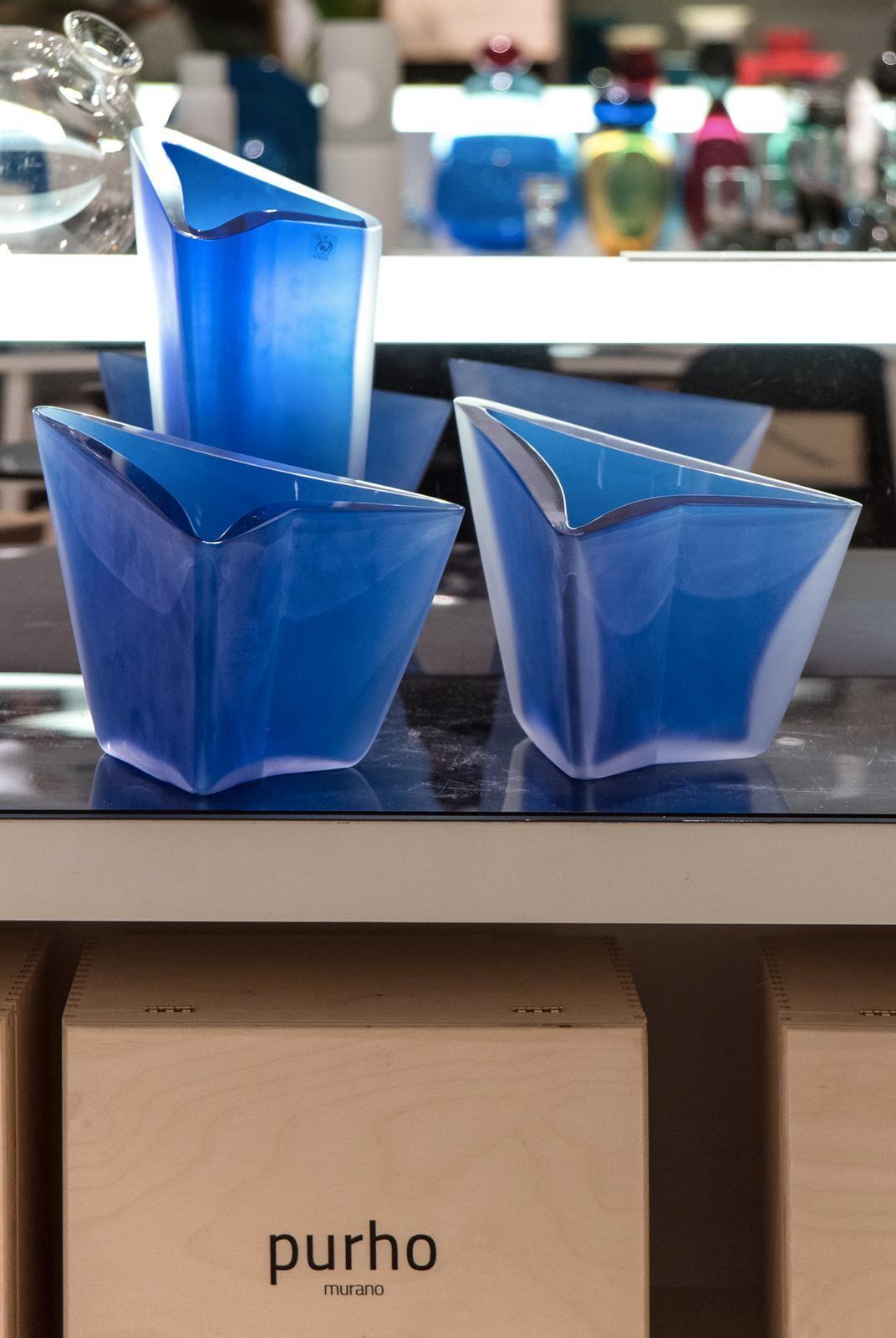 Set of 3 Freccia vases by Purho
Dimensions: D 25 x W 21 x H 36 cm/ D 25 x W 21 x H 16 cm.
Materials: Glass
Other colors and dimensions are available.

Purho is a new protagonist of made in Italy design, a work of synthesis, a research that has