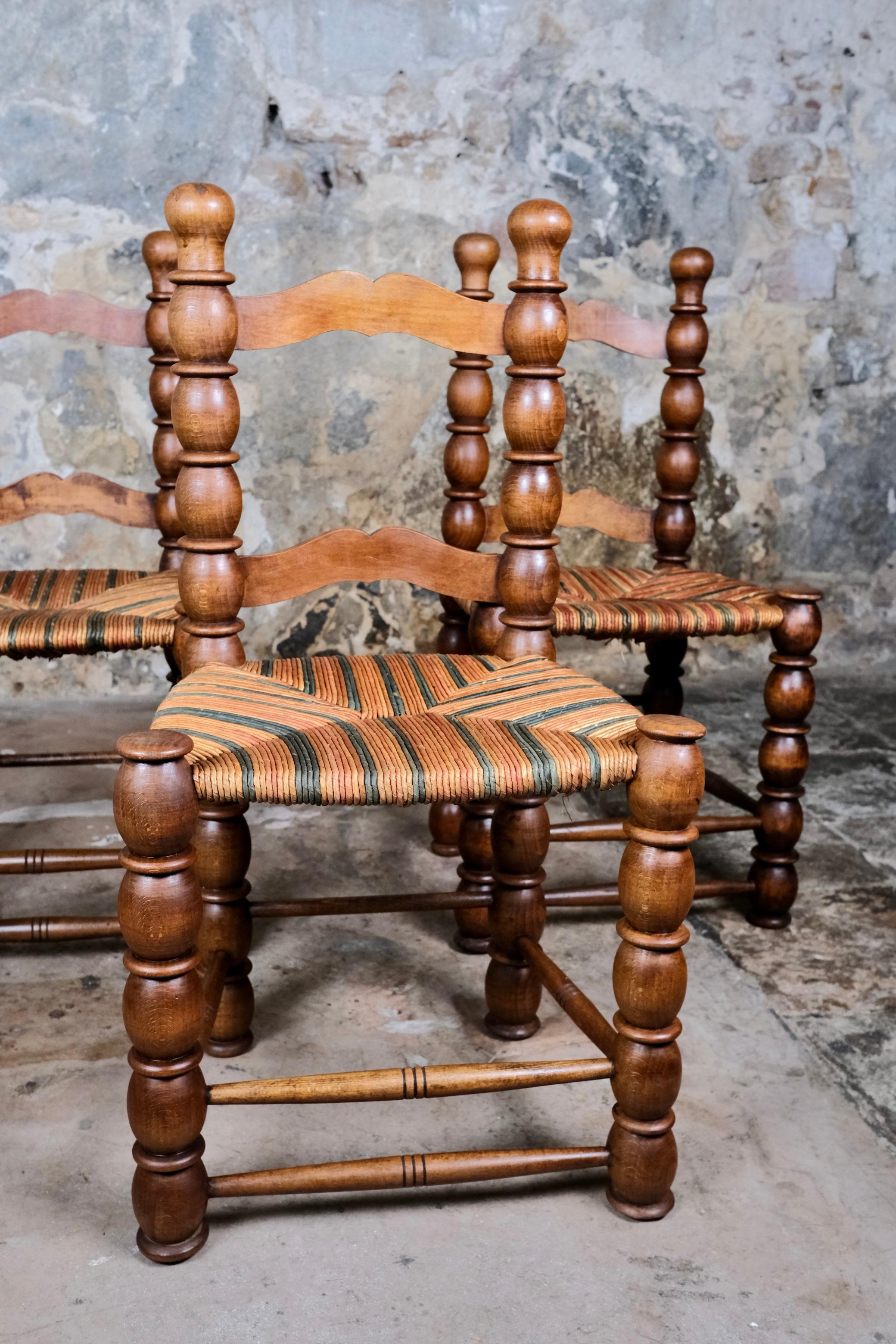 French Provincial Set of 3 French bobbin chairs in the style of Charles Dudouyt, 1940-50s For Sale