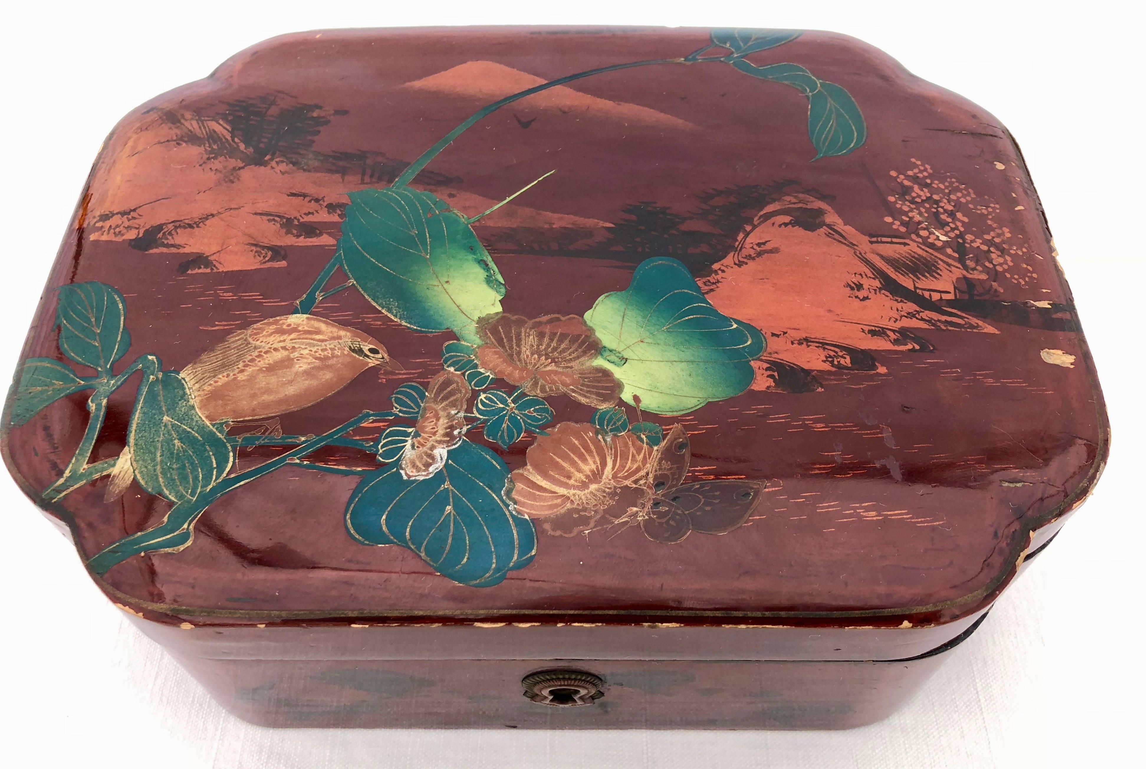 This is a lovely set of three French lacquered boxes in the style of China, which was in keeping with the trend in France during the 1920s. Each box has it's own distinct decoration and colors and are stand alone decorative pieces, but they also