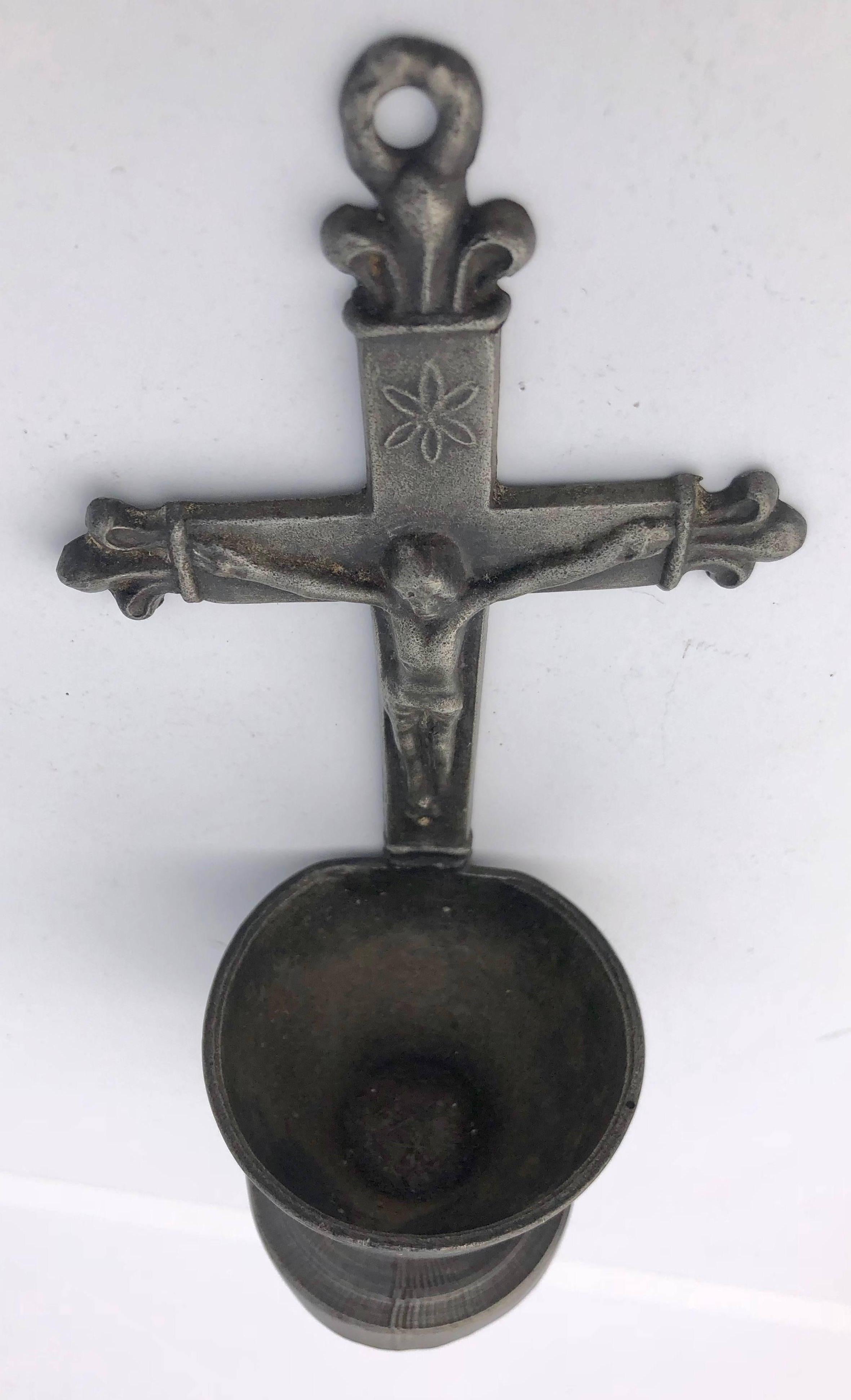 This collection of French pewter holy water crucifix fonts are beautiful. Two of the benetiers are from the early 1900s (the one with Jesus and one with the letters INRI) while one (seen left in the primary picture) is dated about the mid-1800's and