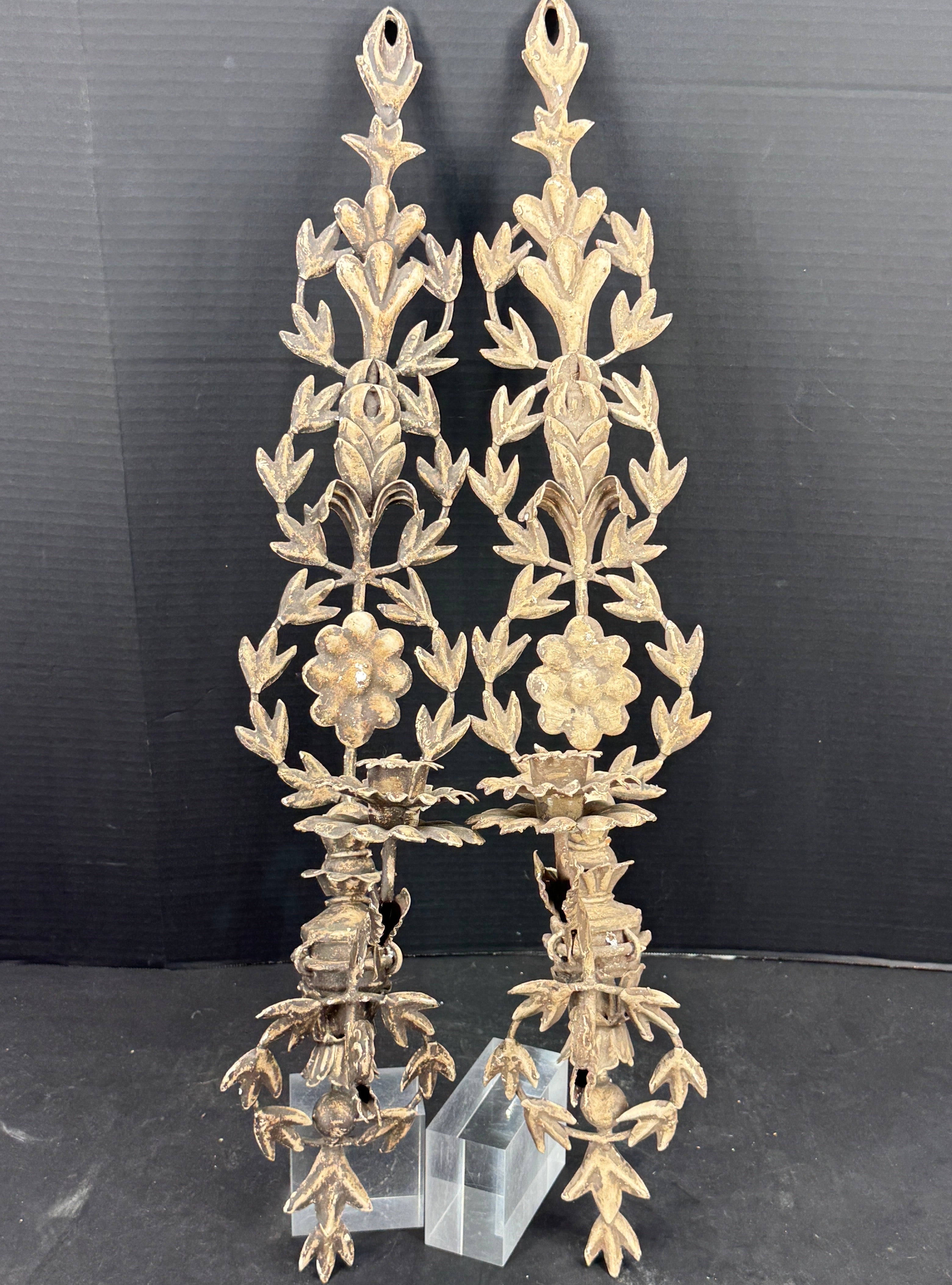 Decorative Metal Candle Wall Sconces from France. Impressive set of three candle sconces that accomodate a single candle in each. This set of three in a neutral color is aesthetically pleasing in their style and construction. Perfect enhancing a