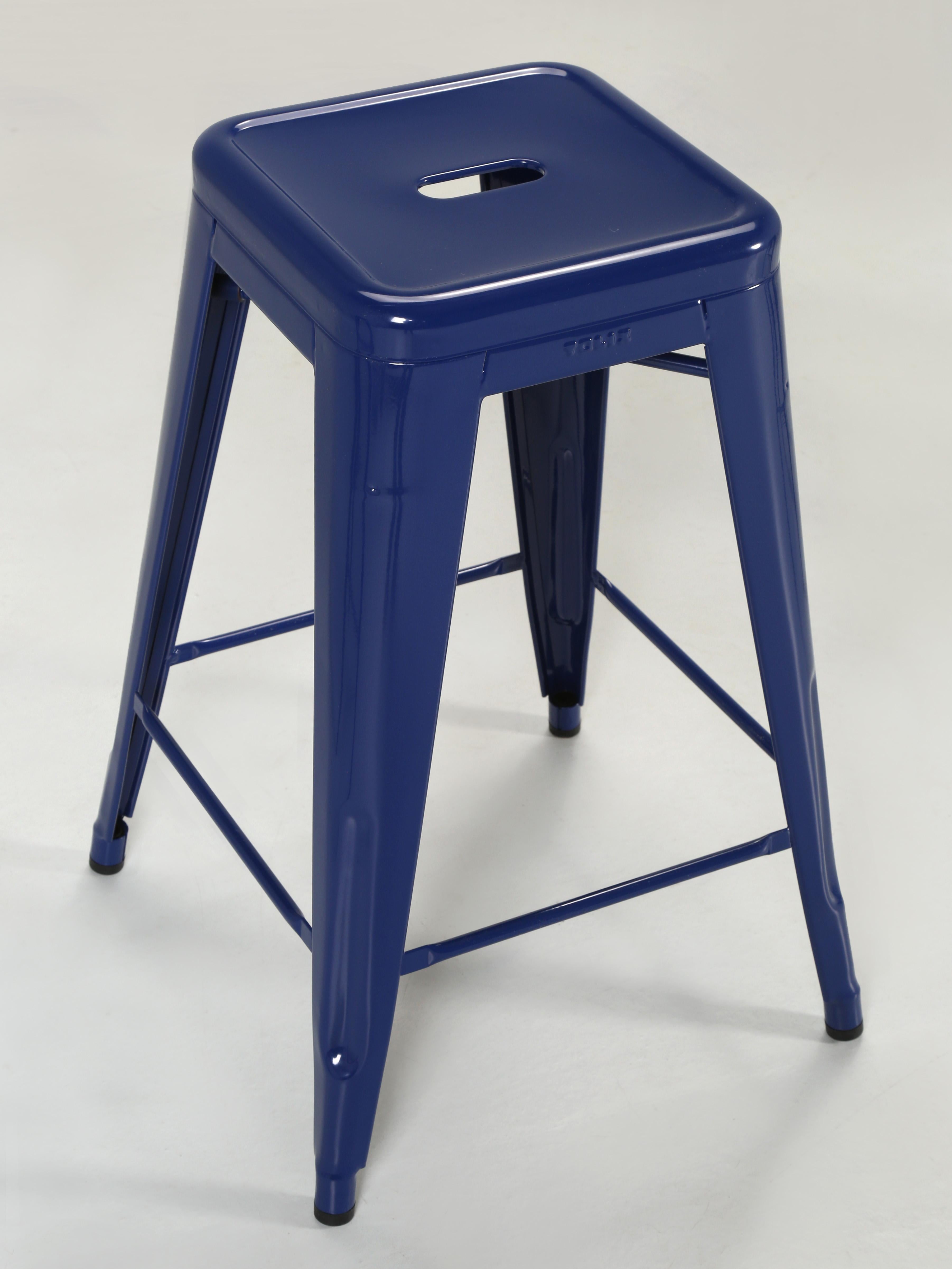 Set of '3' genuine hand-made Tolix kitchen counter stools in dark blue. The Tolix kitchen counter stools are considered an iconic design and their matching chairs (also in stock), and have been displayed in the New York Museum of Modern Art,