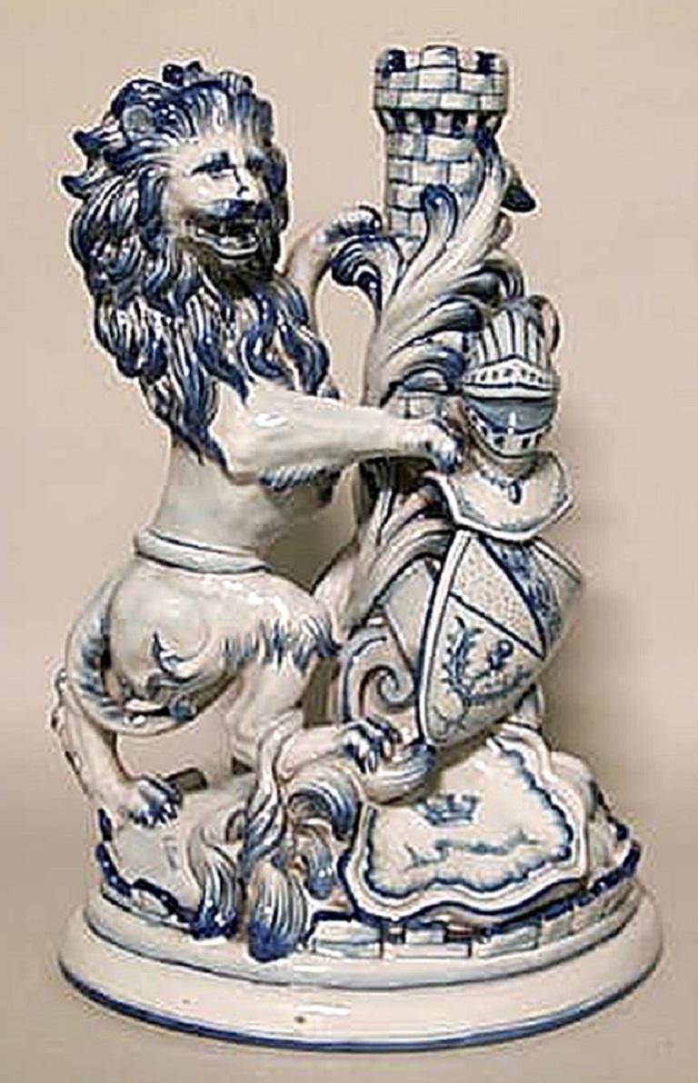 Set of 3 French Victorian blue and white porcelain lion clock and pair of candelabra (signed St. Clement - Estate of Evelyn Walsh McLean) (priced as set).
      