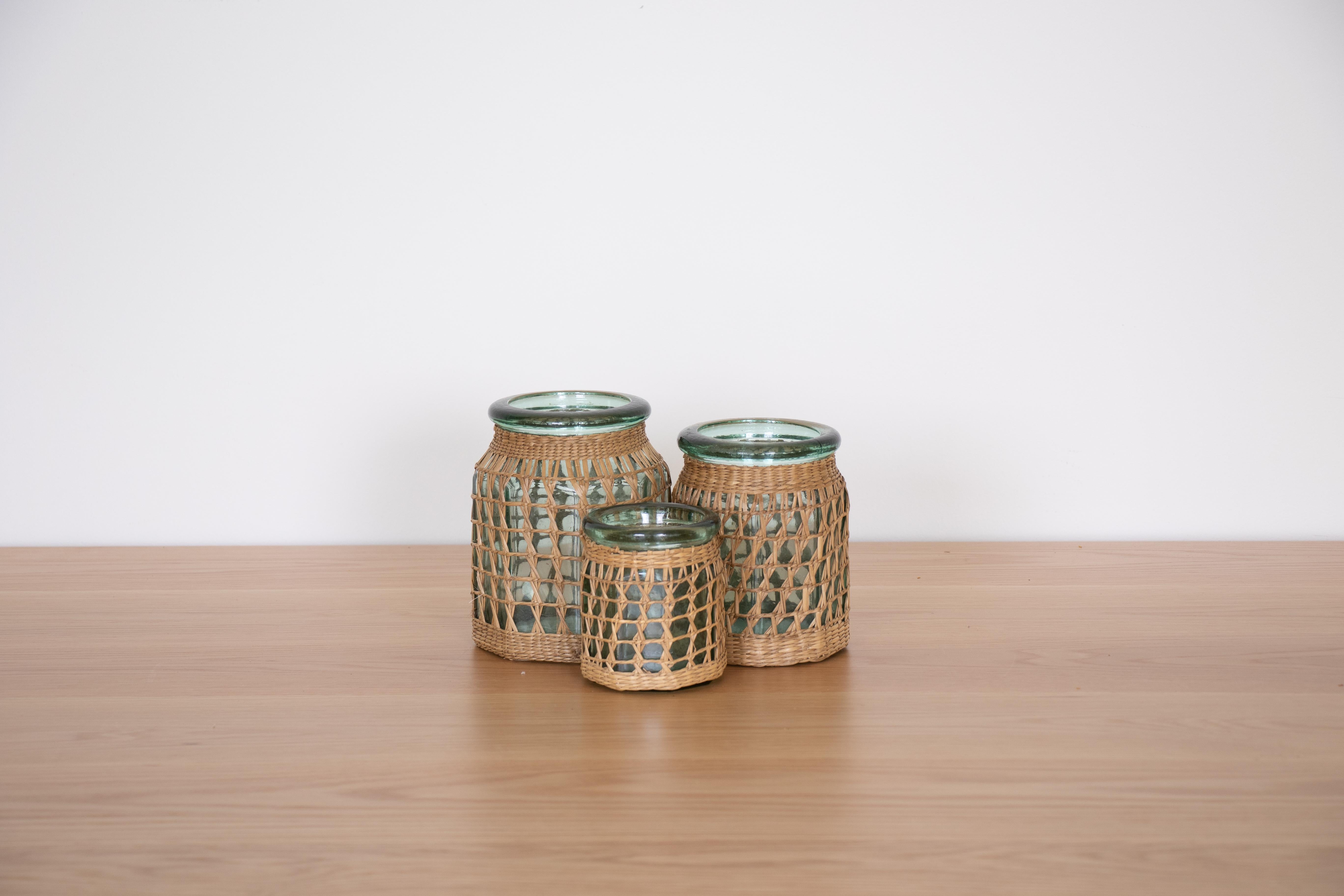 Set of 3 French green glass jars wrapped in woven seagrass from the 1960s. Sold as a set.
Three sizes:
Large 6.25