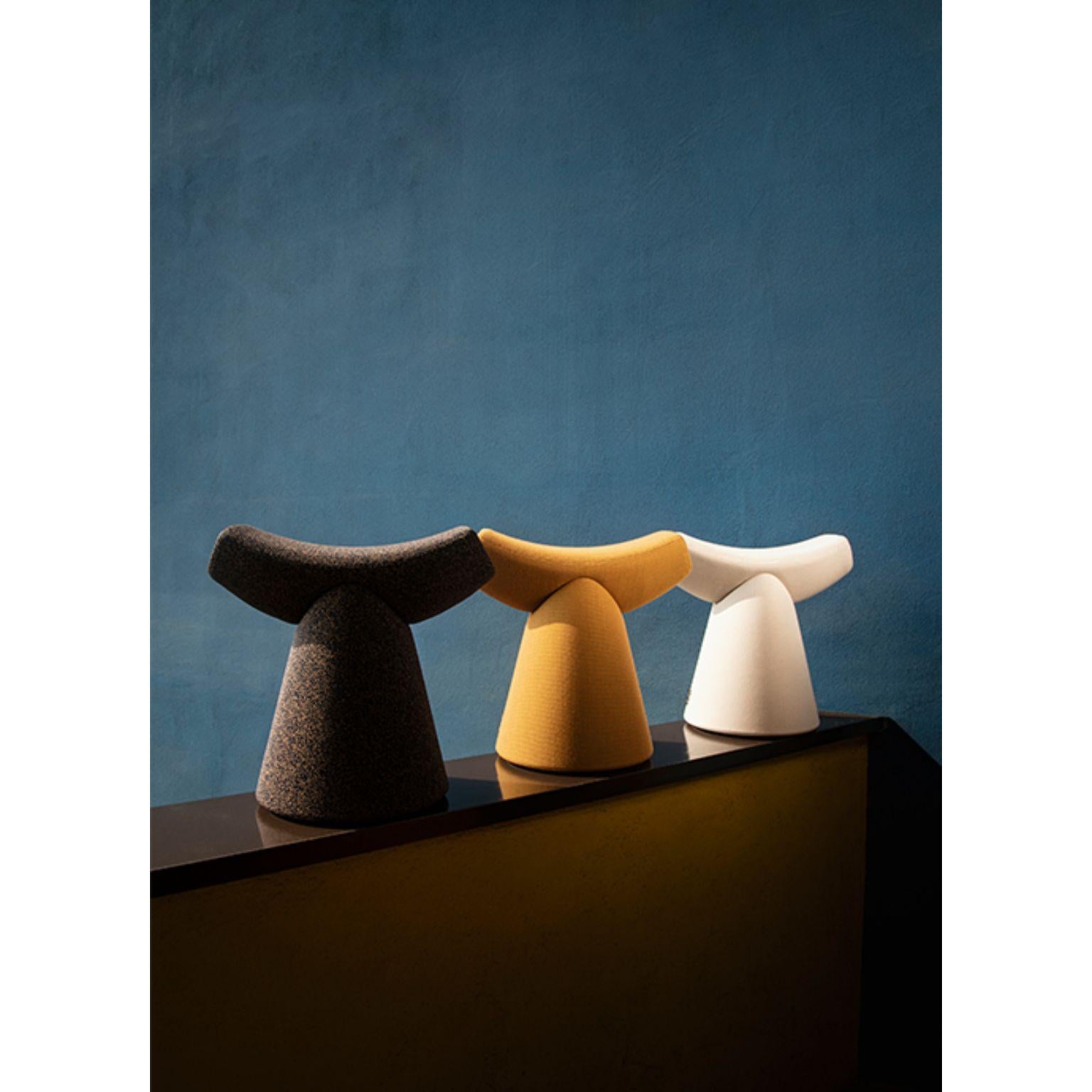 Set of 3 gardian stool by Patrick Norguet.
Materials: fabric (also available in leather).
 Handle: noce Canaletto solid wood.
Dimensions: W51.1 x D34.7 x H49.8 cm.

For the Gardian stool by designer Patrick Norguet, the concept of seating was