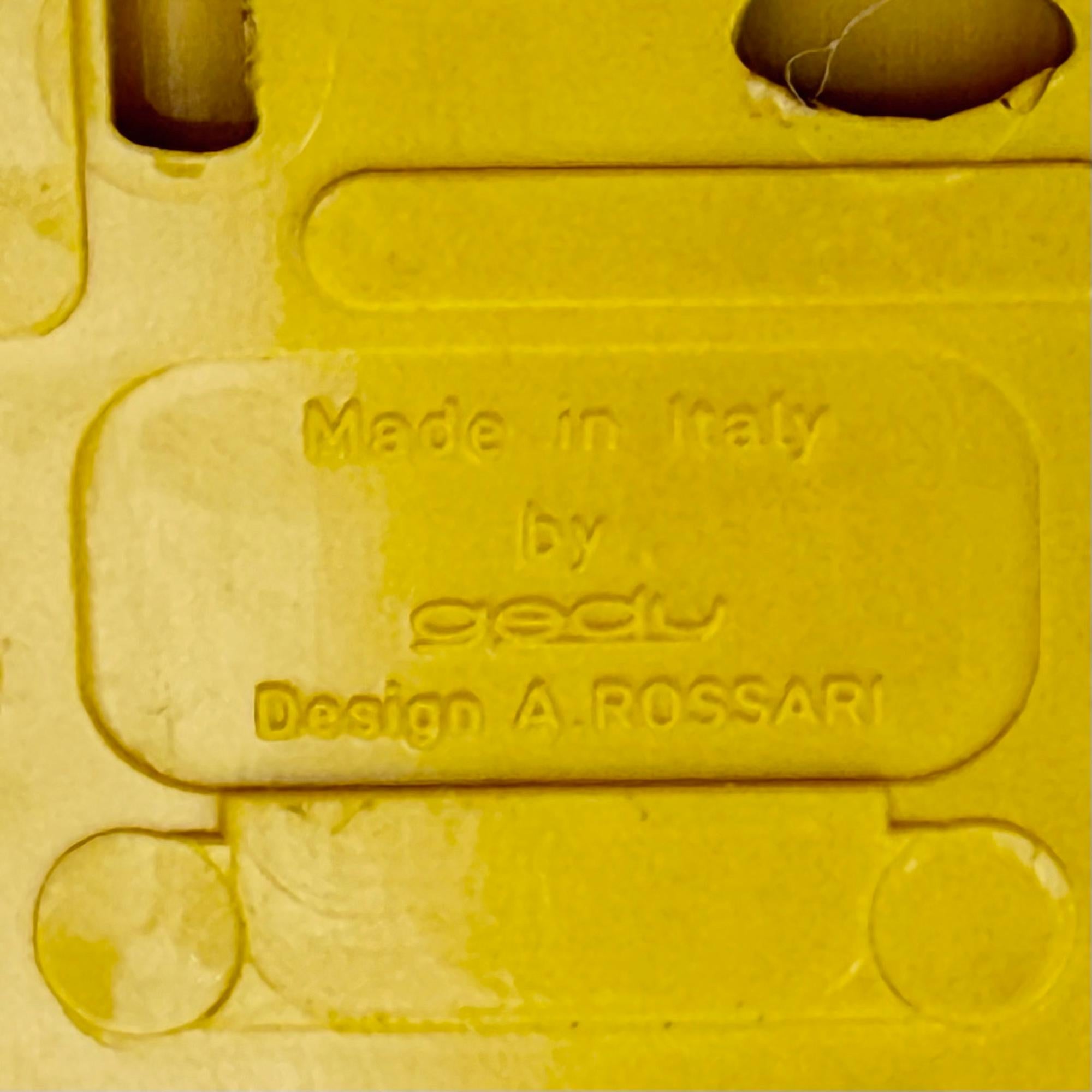 This set of three Gedy coat hooks was designed by Ambrogio Rossari and manufactured in Italy during the 1970s. Produced in durable yellow plastic, the hooks reflect the optimism and innovation of the Space Age, when Italian designers reimagined