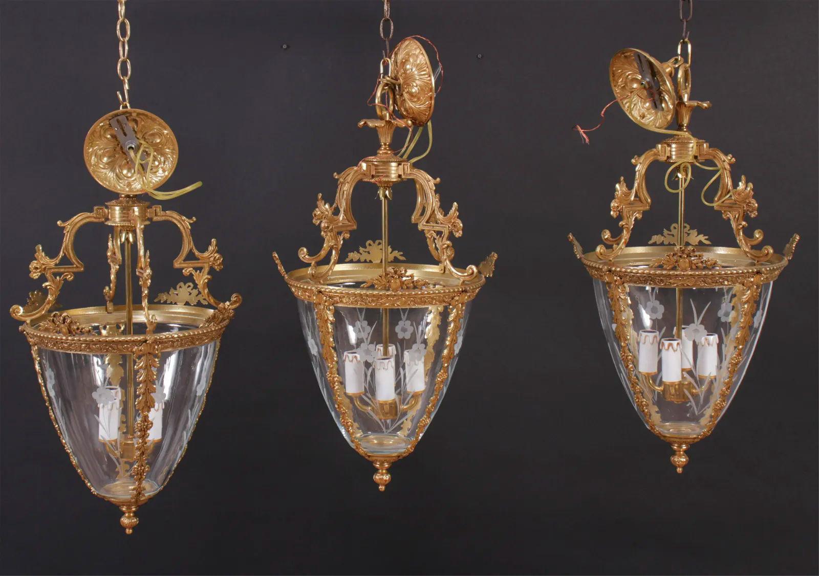Set of 3 Gilt Bronze and glass Louis XVI style Lanterns.