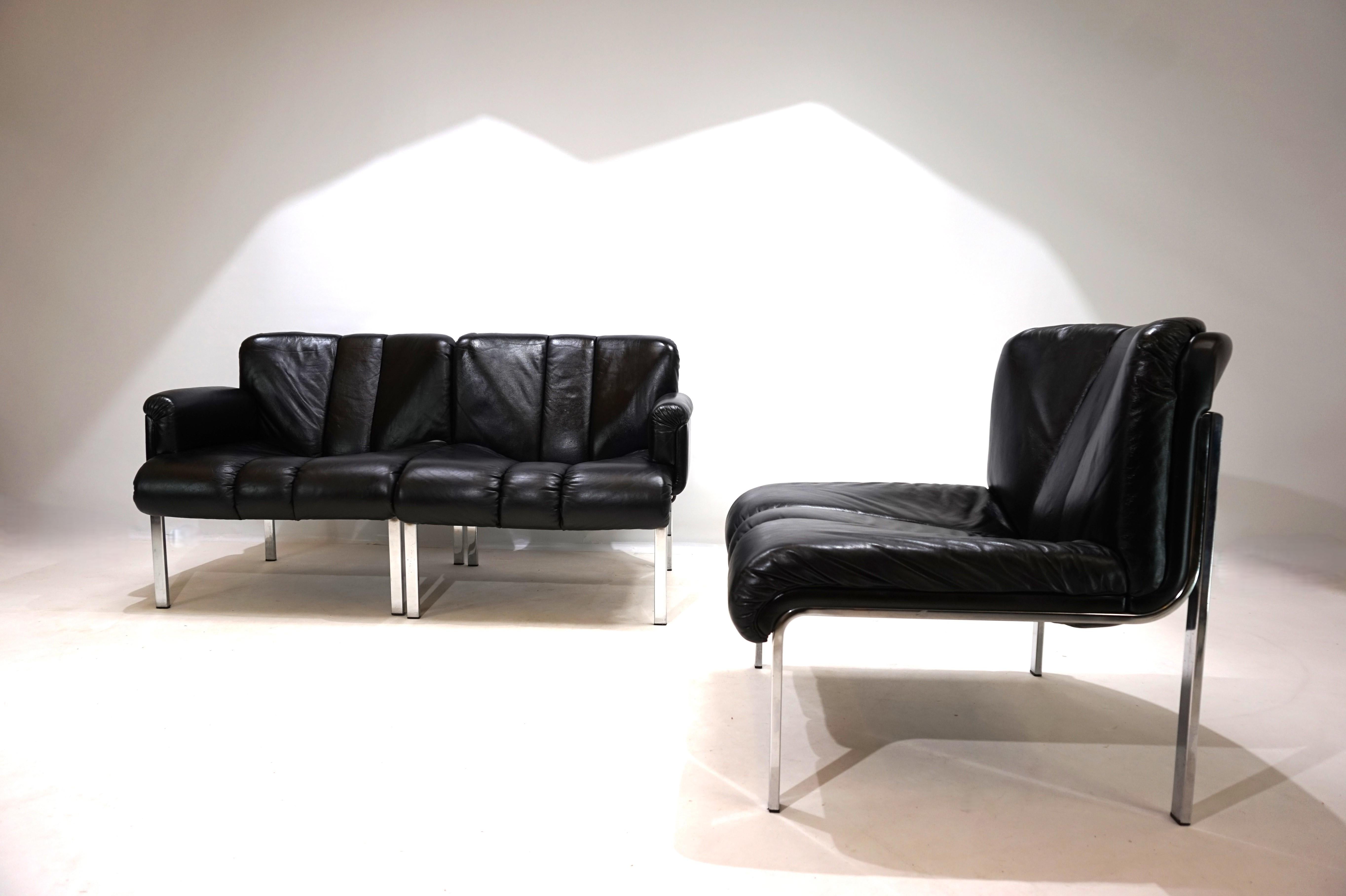 This set of three Girsberger Eurochairs in black leather is in very good condition. The leather is soft and shows only minimal signs of wear, such as a slight abrasion mark on the back of one chair. The chrome frame has its full shine and shows no
