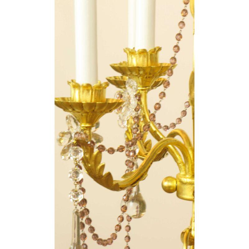 Set of sconces, two matching, and one coordinating. 23K gold leaf, with original amethyst crystals and beaded crystal strands. Attributed to E.F. Caldwell C. 1915. These are similar to known works, are were located in a Boston Back Bay Estate with