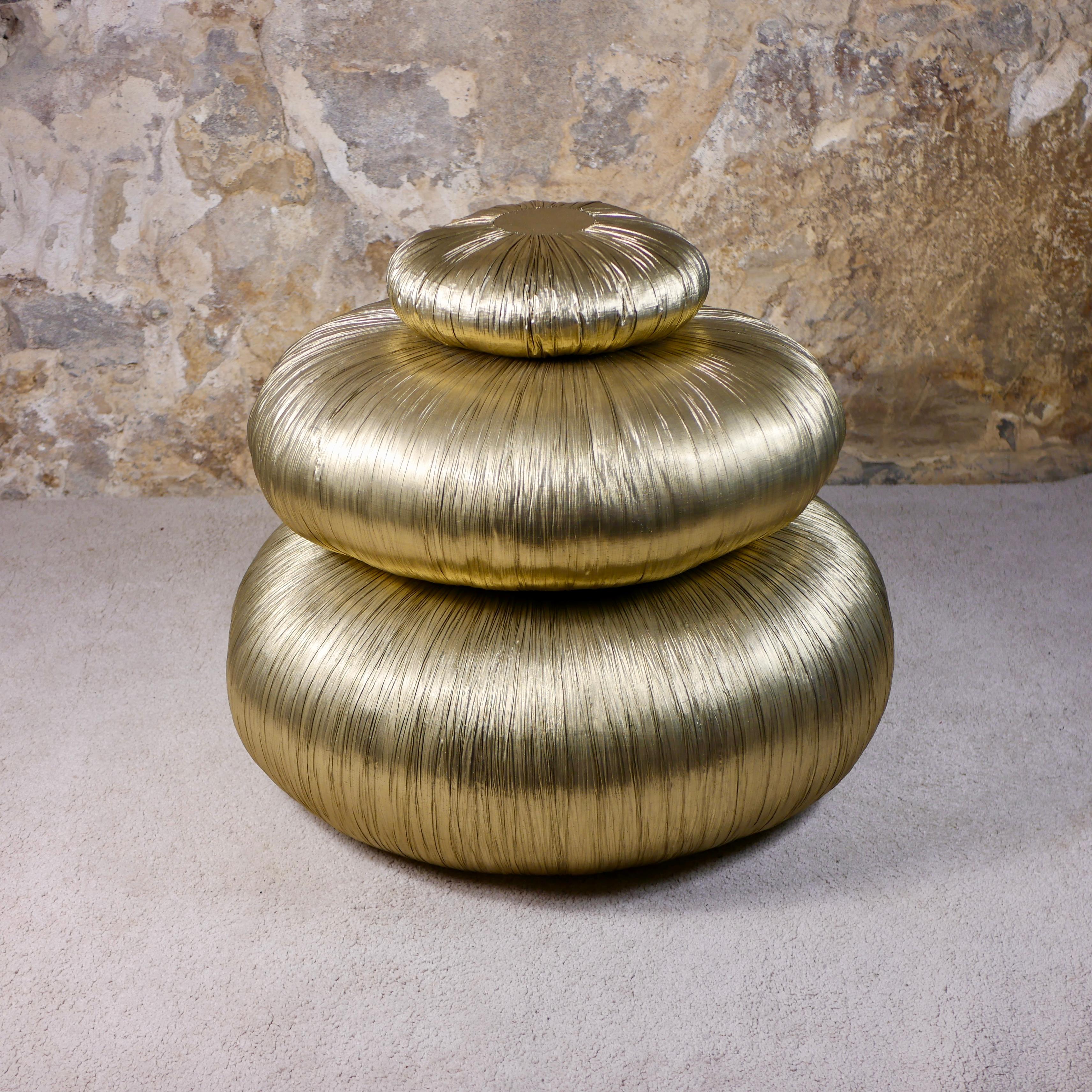Beautiful and rare set of 3 poufs (2 poufs and 1 cushion), in golden polyester, filled with kapok, made in France by Marie-Claude Fremau in the 1980s.
Marie-Claude Fremau was a lingerie designer, and made a few of this poufs.
Good condition overall,