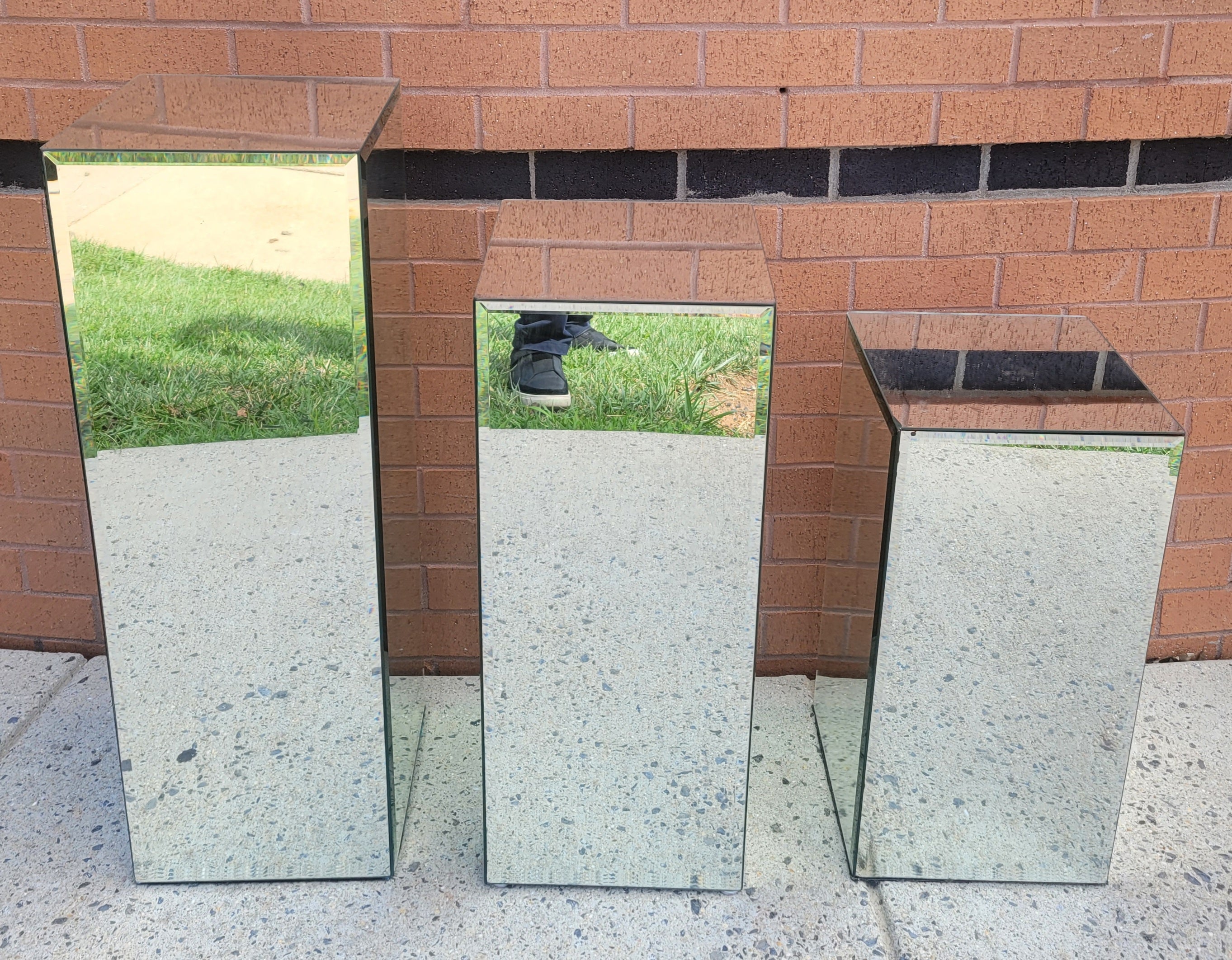 This pedestal is mirrored on all four sides and also the top. Each pane is beveled. Use them as plant stands.
They are perfect for displaying sculptures or valuable vases. 
Tallest one measures 12.25