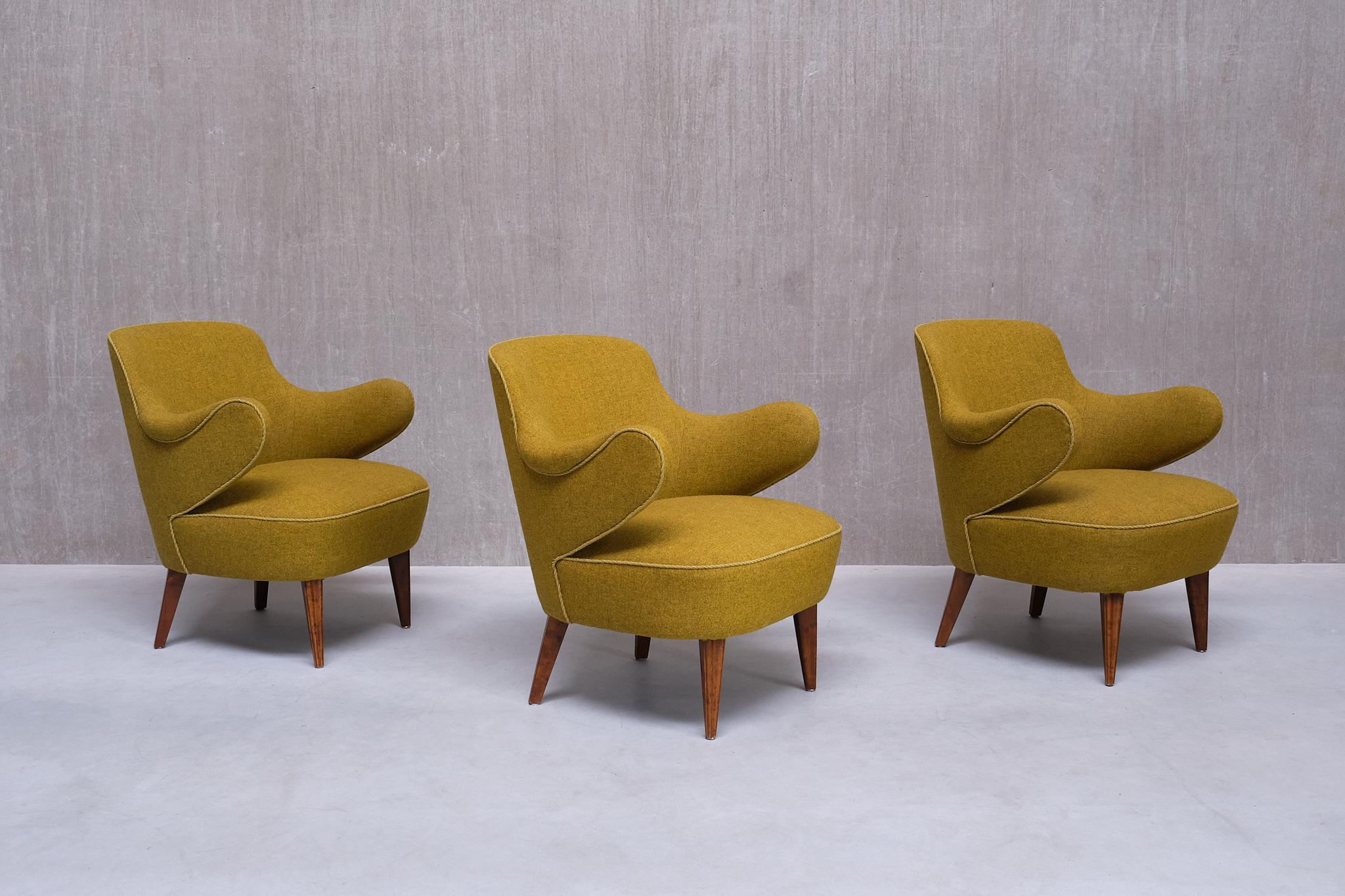 This striking set of three armchairs was produced in Sweden in the 1940s. The design is attributed to Gustaf Axel Berg, the head designer of his own company AB G.A. Bergs.  The chairs are available as a set of three, also available as a pair or