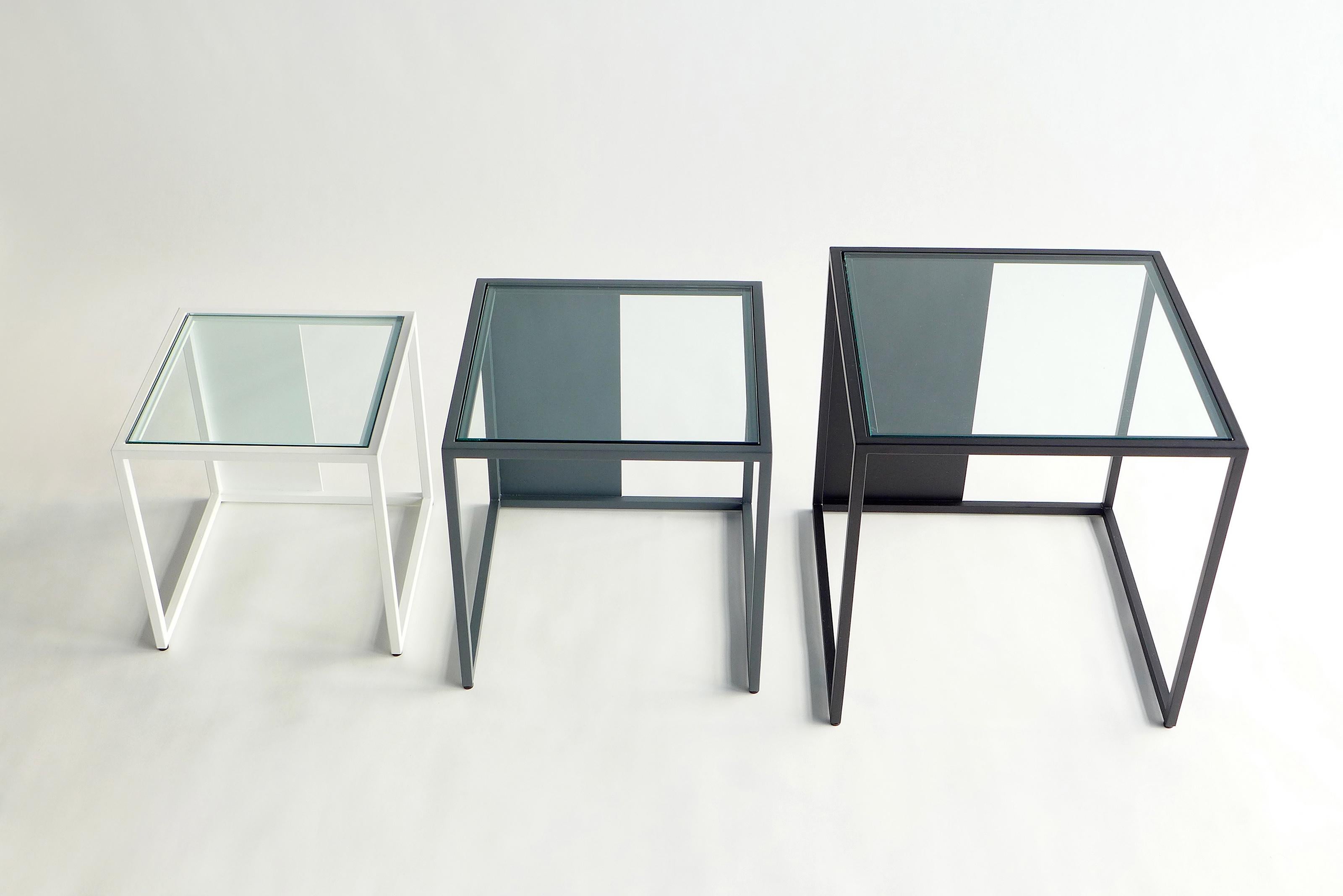 Set Of 3 Half & Half Nesting Tables by Phase Design
Dimensions: Large: D 40.6 x W 40.6  x H 40.6 cm. 
Medium: D 35.6 x W 35.6 x H 35.6 cm. 
Small: D 30.5 x W 30.5 x H 30.5 cm.
Materials: Powder-coated metal and glass. 

Powder-coated square steel