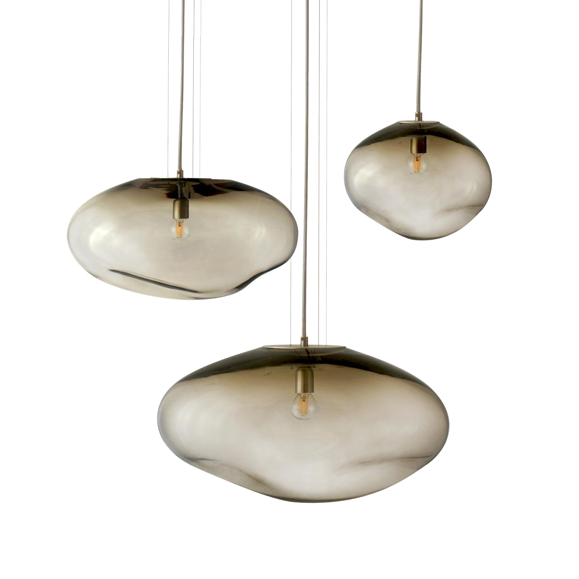 Set of 3 Haumea Amorph silver smoke M/L/ XL pendants by ELOA
No UL listed 
Material: glass, steel, silver, LED Bulb
Dimensions: D 35 x W 47 x H 32 / D 27 x W 39 x H 30/ D 30 x W 32 x H 27 cm
Also available in different colours and dimensions.

All
