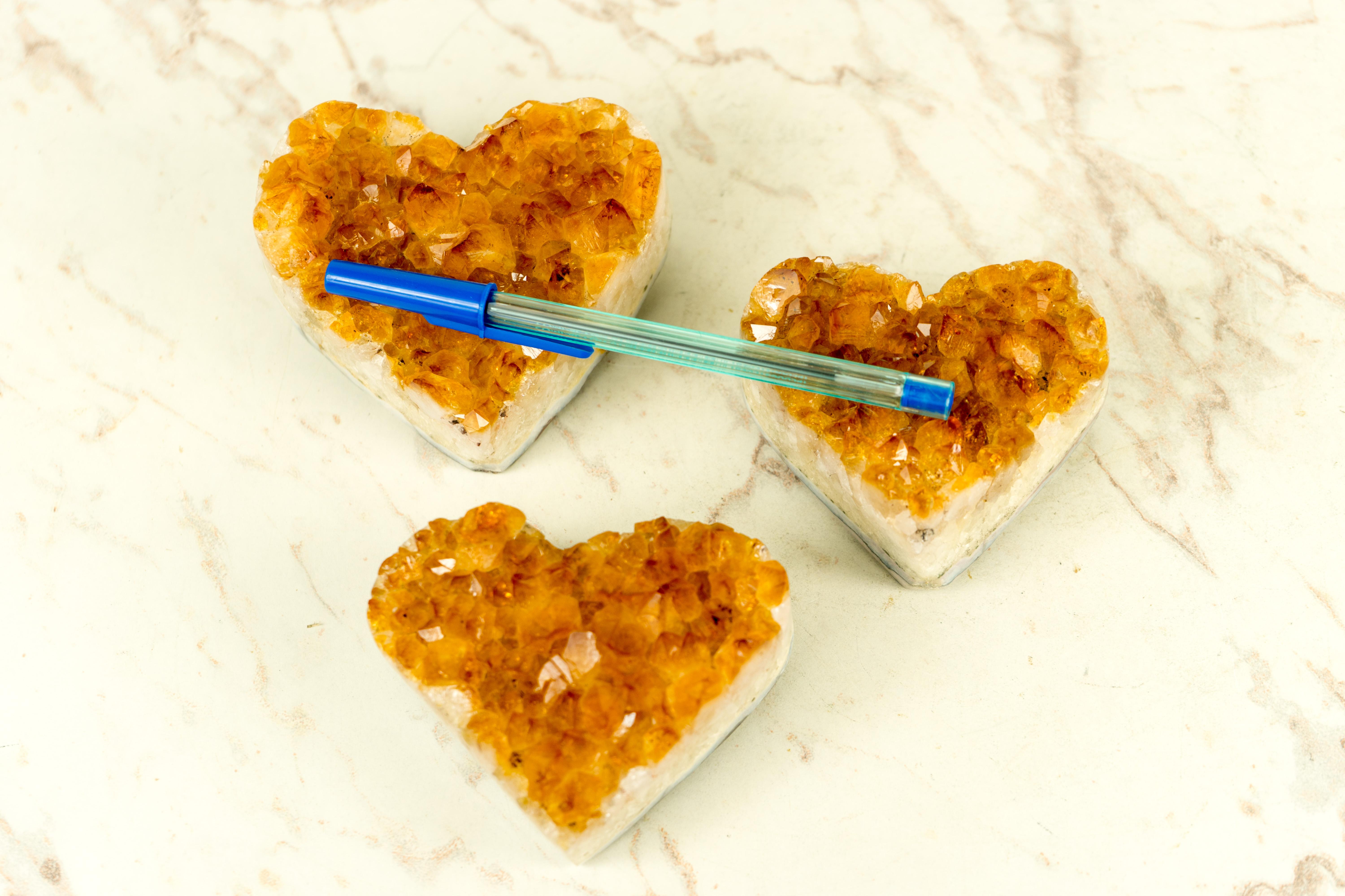 We selected this set of Citrine Hearts with high quality, deep orange color, and the overall beauty and shine of the hearts in mind. With each heart having its particular rare characteristics such as the Goethite inclusions, perfect natural points,
