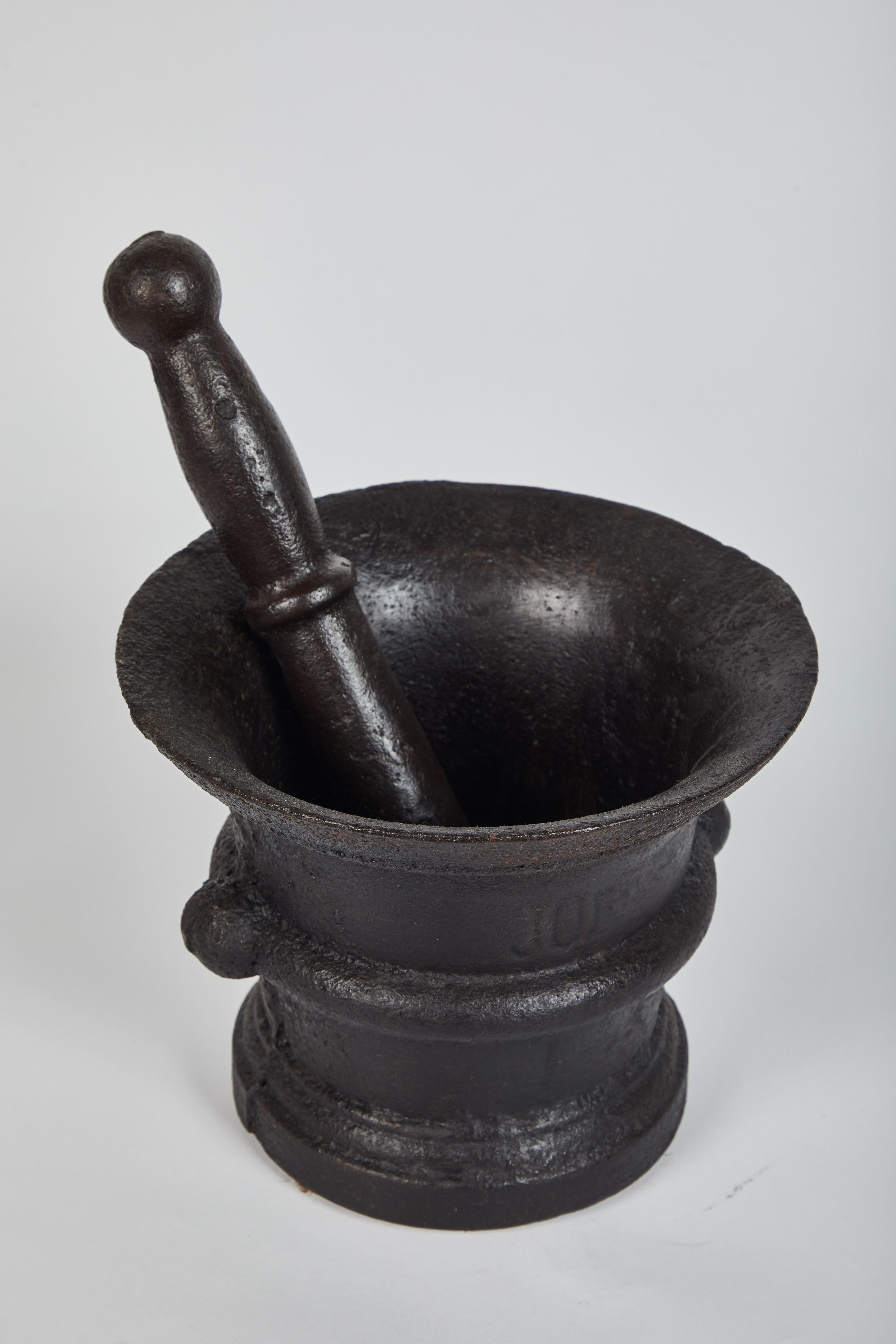 An early 1900s Indonesian cast iron mortar and pestle, set of three sizes. Heavy base with matching pestle. From Java, Indonesia. Primarily used for the grinding of coffee beans.
Size:
Large 6.25