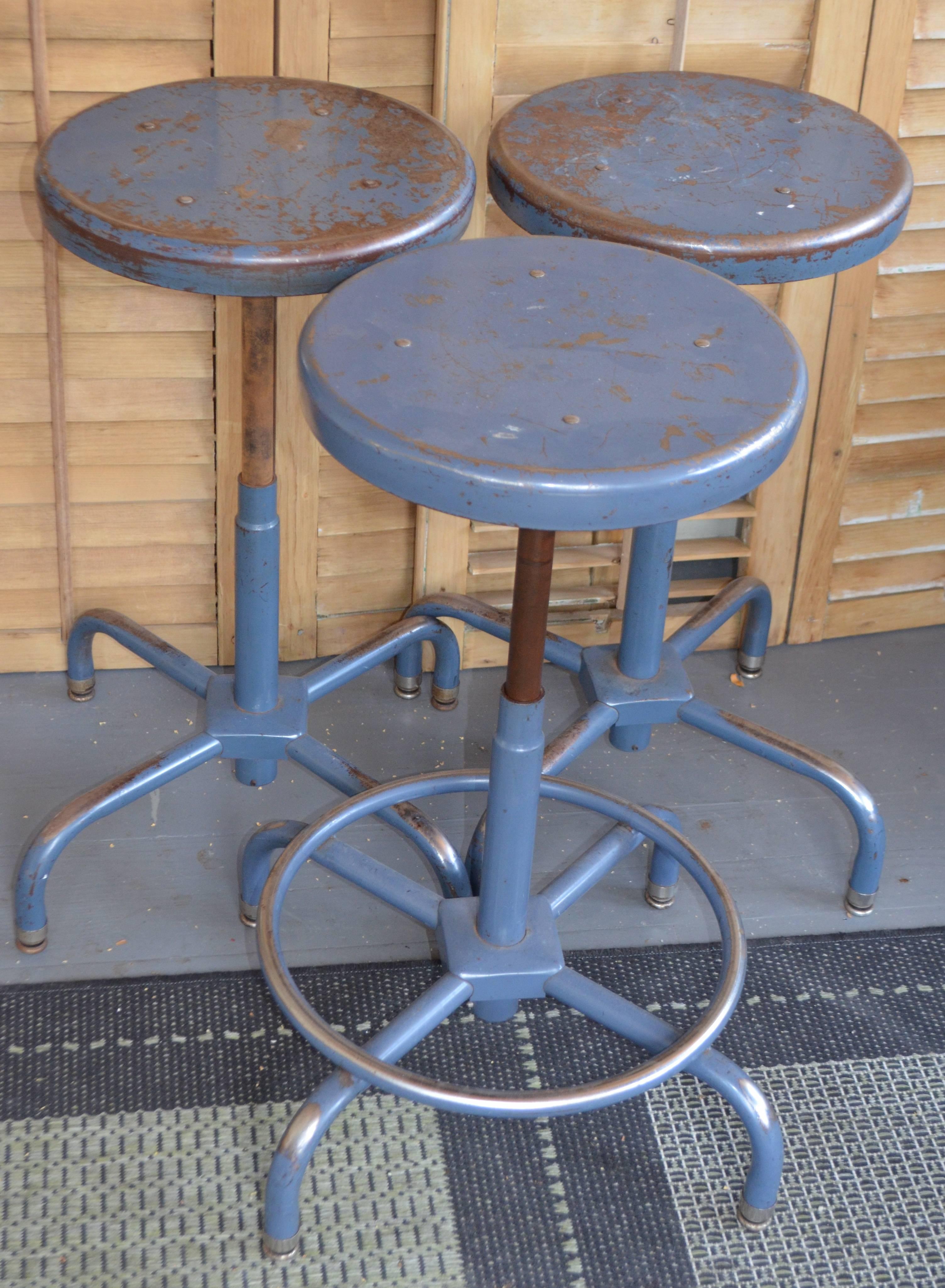 Set of three adjustable steel stools that sit sturdily on four legs. You can easily adjust its height from 18.5