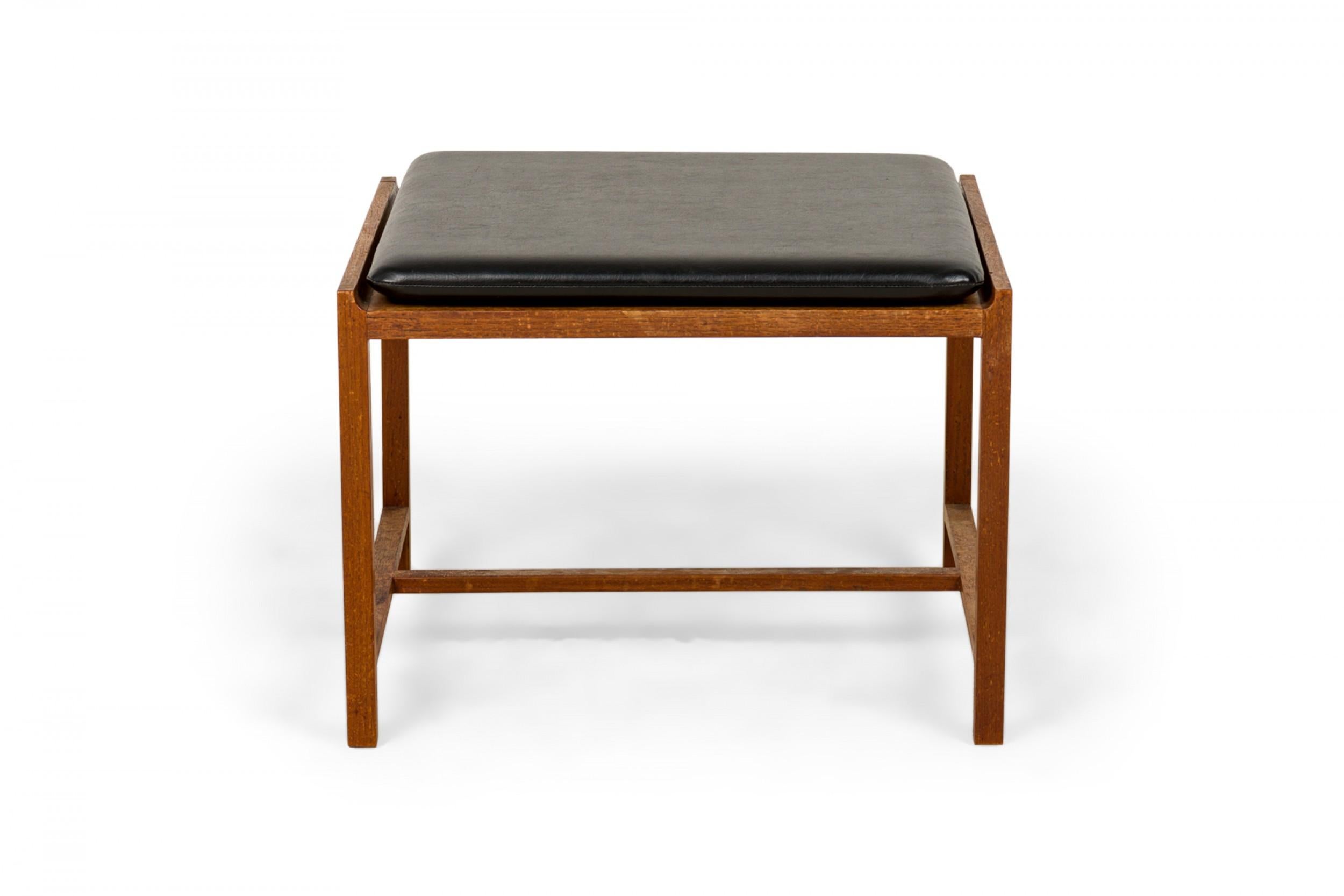 SET of 3 Norwegian Mid-Century low stools / side tables with rectangular walnut frames with stretcher bases, topped with black leather upholstered seats / tops. (INGMAR RELLING FOR BROTHERS BINDEIM)(PRICED AS SET).
 