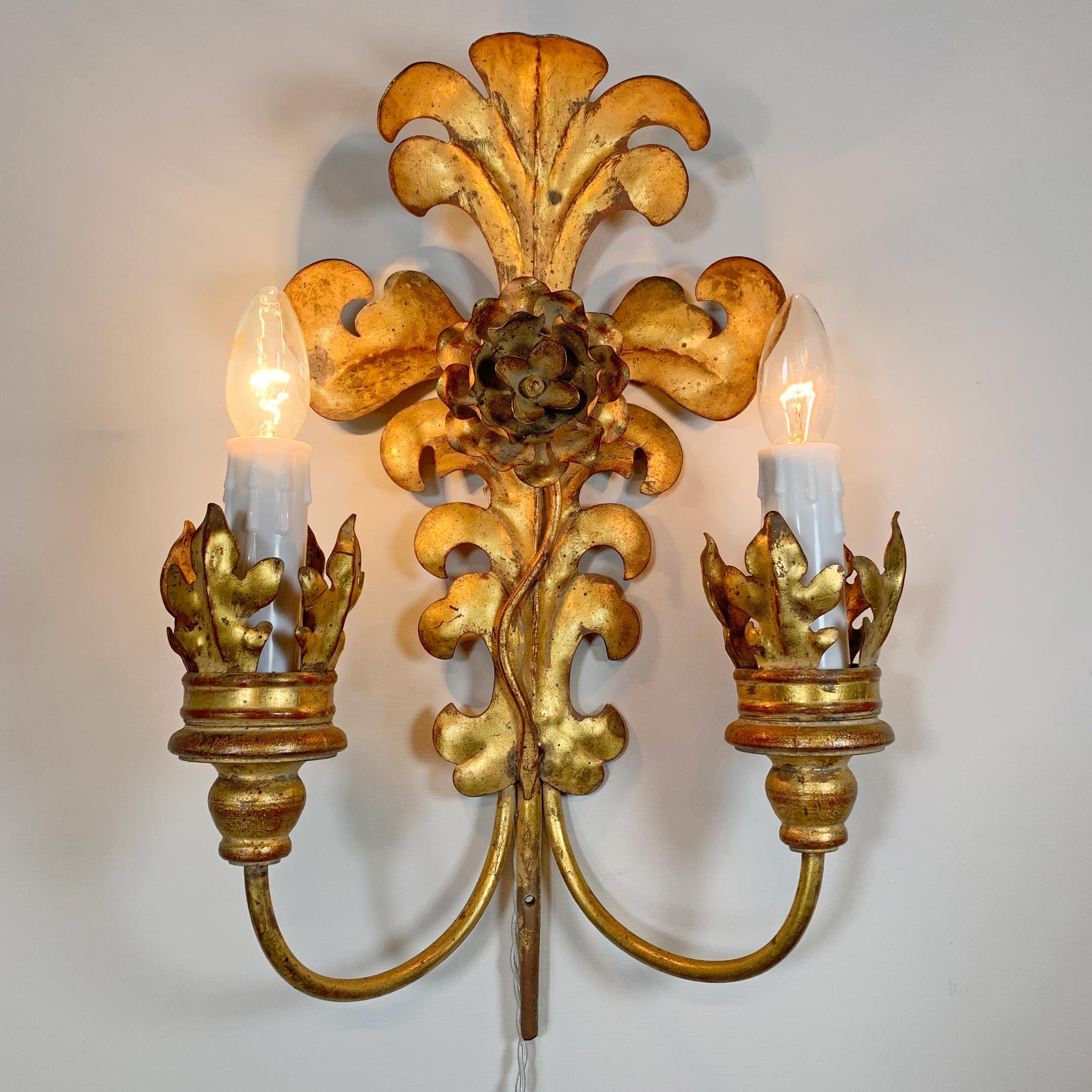Fabulous set of 1980s Italian wall lights, in gilt metal, shaped as acanthus leaves with a floral centre. Each lamp has two e14 (small screw in) lamp holders. These are very large lights of exceptional quality, the price shown is for the set of 3