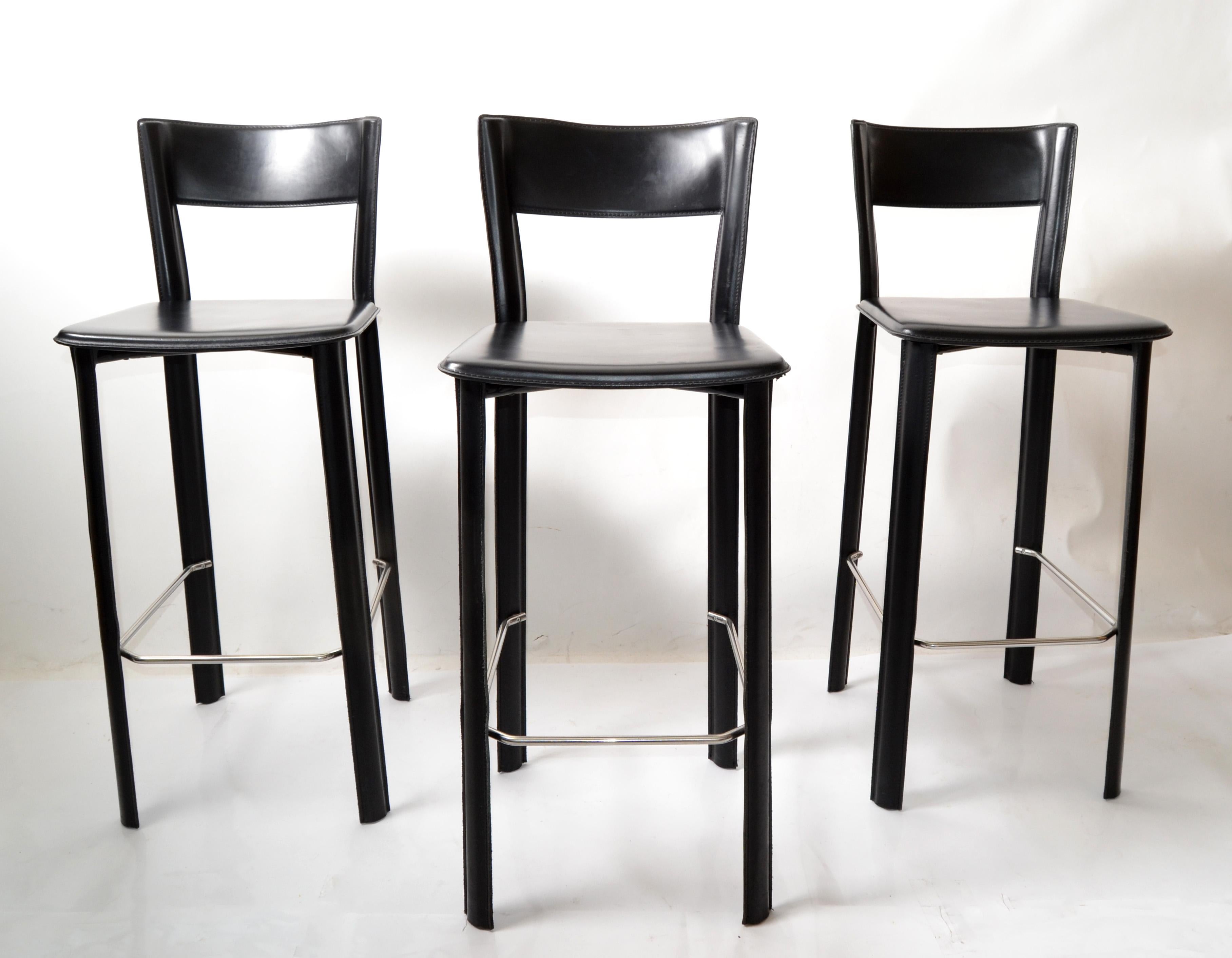 Modern set of 3 bar stools in black leather by Frag, made in Italy.
Extraordinary hand stitched Soft Leather over a Steel Tubular Frame with Chrome Footrest. 
All Chairs are marked with original Labels: Hand Made in Italy, Frag.
Footrest measures