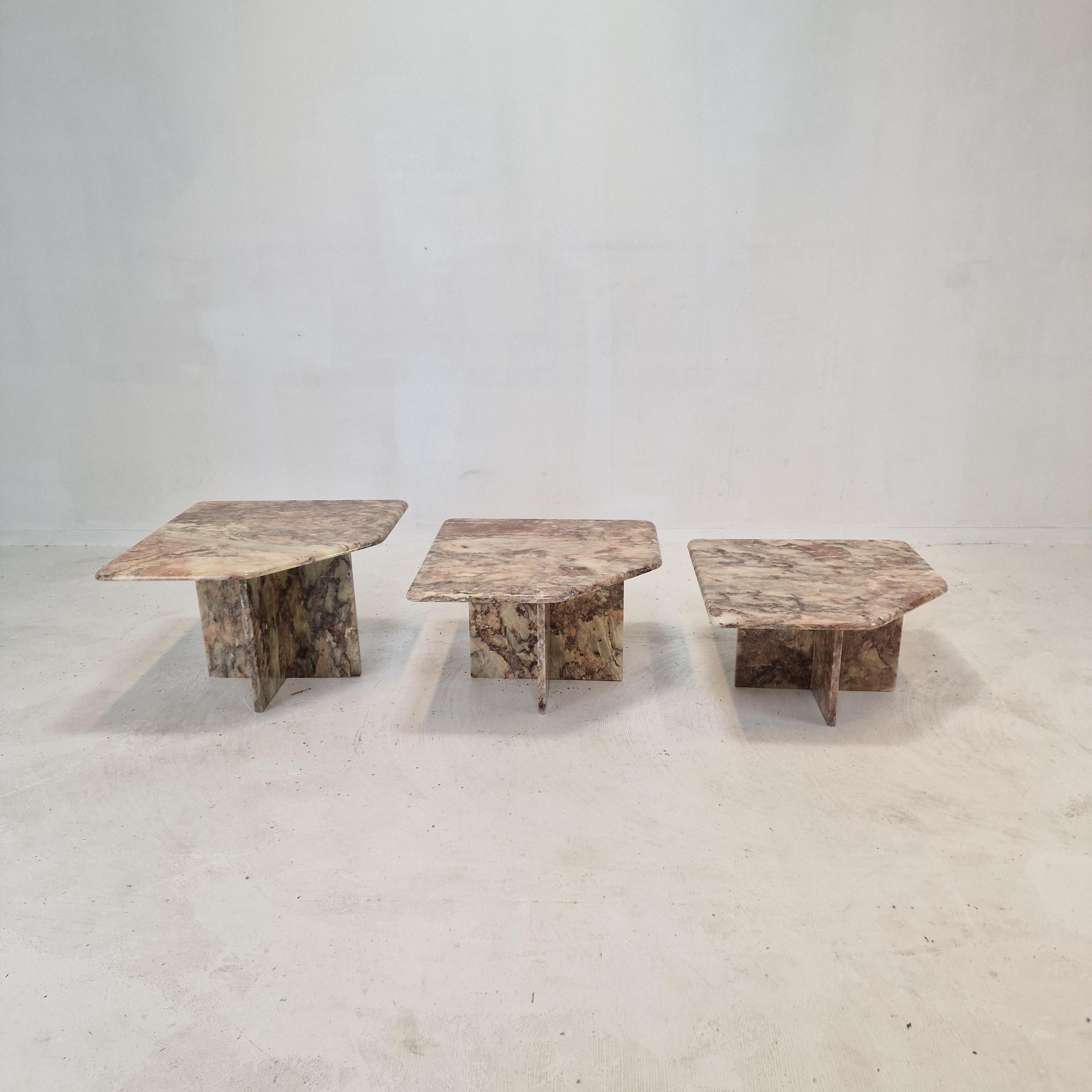 Stunning set of 3 Italian coffee or side tables, handcrafted out of marble. 
They can be used inside or outside the house.

The tables all have a different height so they fit under each other. 

The plate and the base are made of beautiful