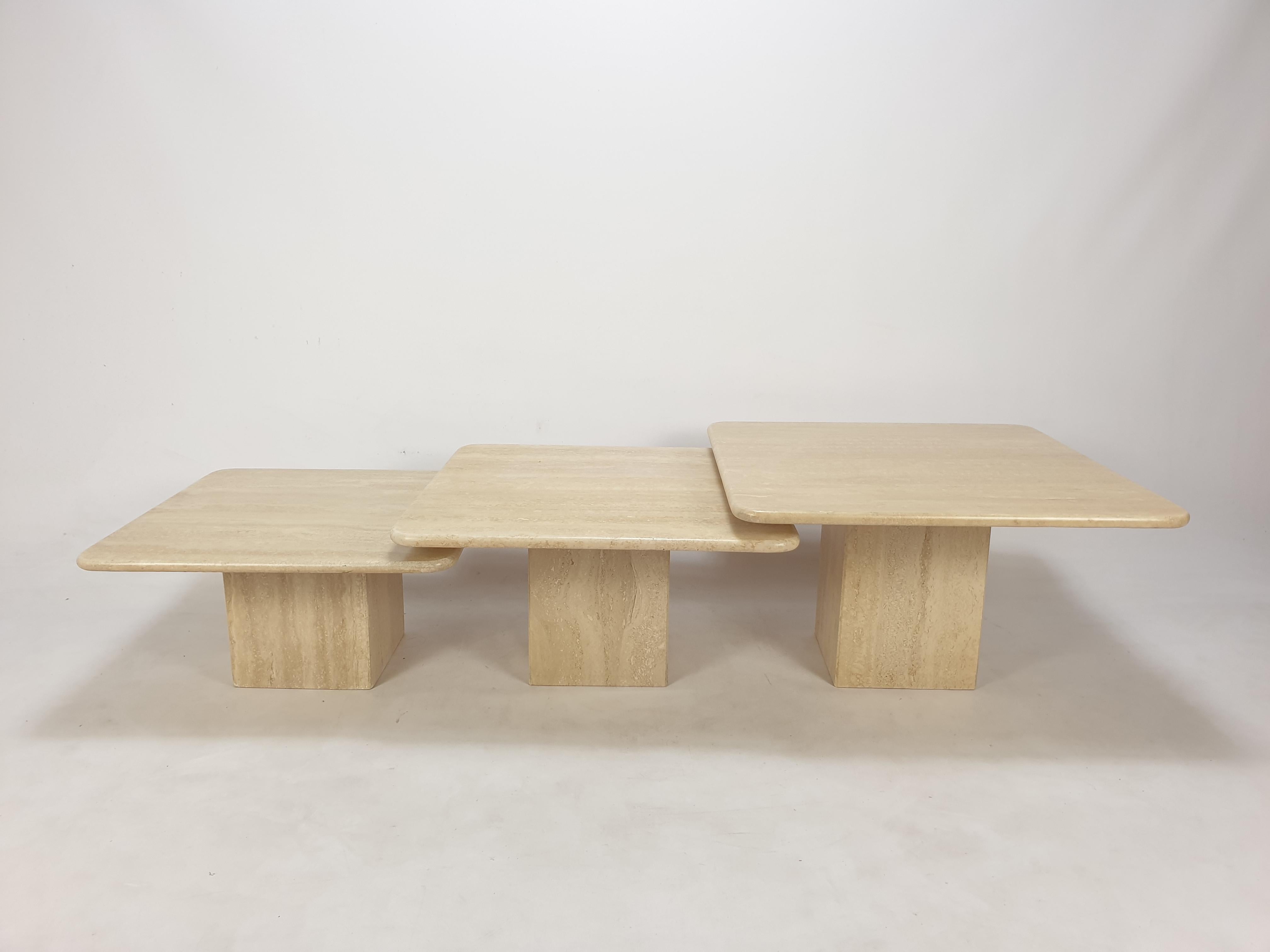 Very nice set of 3 Italian coffee tables, handcrafted out of travertine. 

The tables have all a different size so they fit under each other. 

The plate and the base are made of very nice travertine.

Size table 1:
70 x 70 x 40 cm
27,56 x