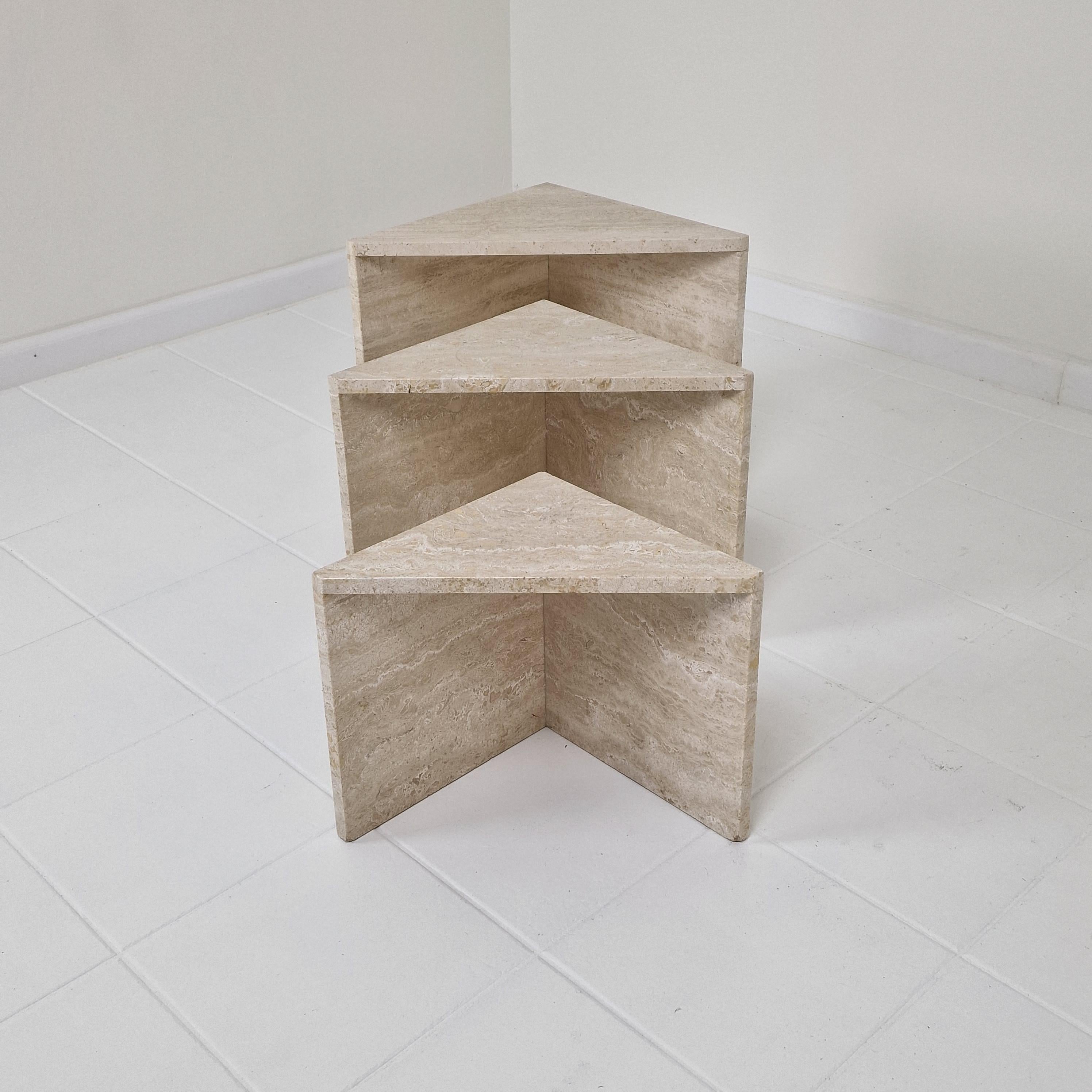 Magnificent set of 3 Italian nesting or side tables, handcrafted out of travertine.
This very rare version is fabricated in the 80's.
They can be used inside or outside the house.

They are made of beautiful travertine.
Please take notice of the