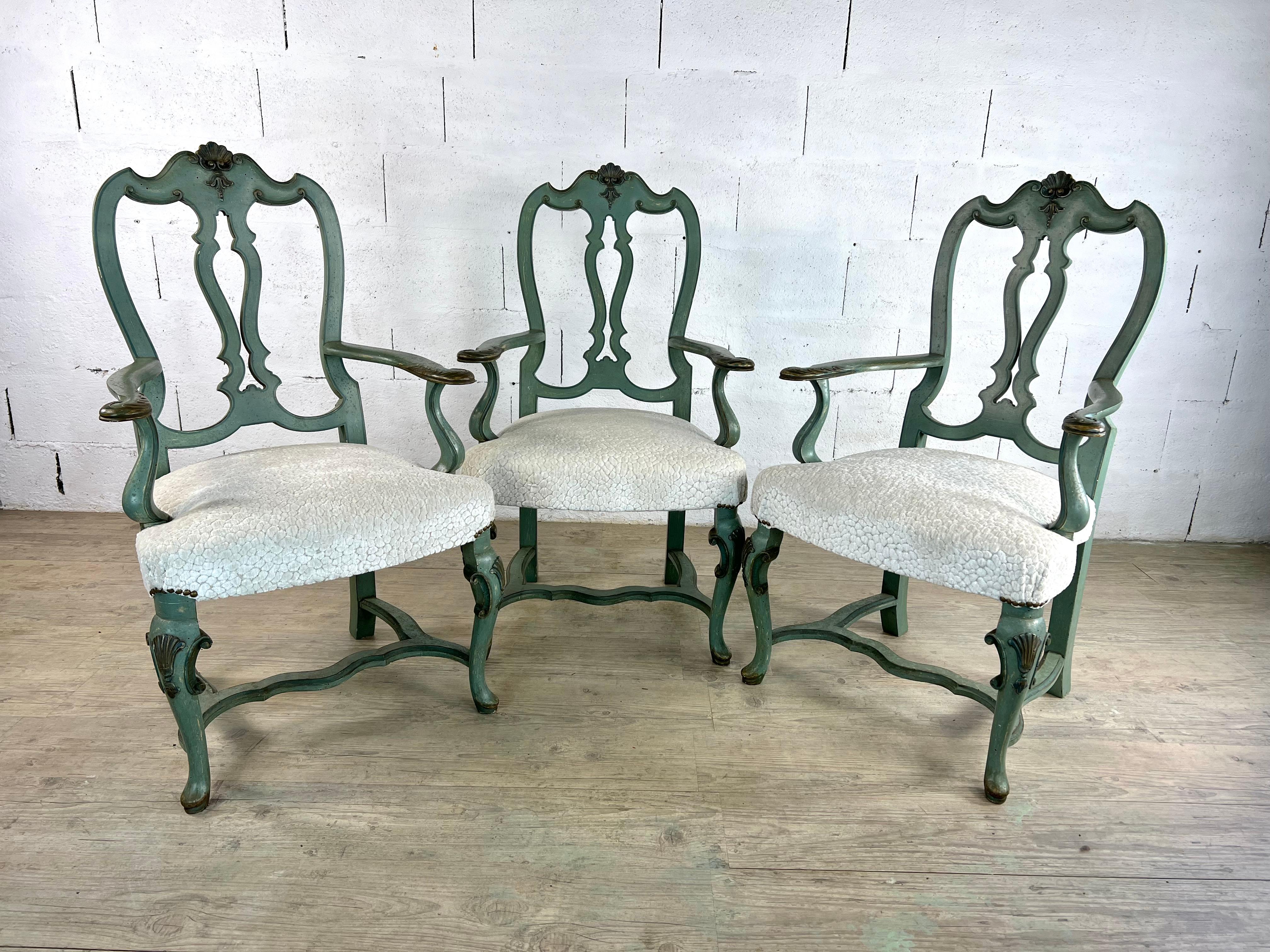 This exquisite set of three 19th-century Rococo-style armchairs captures the essence of elegance and comfort, featuring a soft blue patina that blends seamlessly into both classic and contemporary interiors. The Rococo movement, originating in the