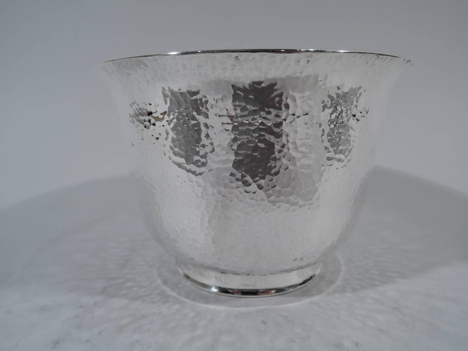 Set of 3 Japanese hand-hammered silver bowls. Each: Flared rim and curved bottom. Shimmering honeycomb pattern. Short plain foot. Hallmarked. Total weight: 34 troy ounces.
