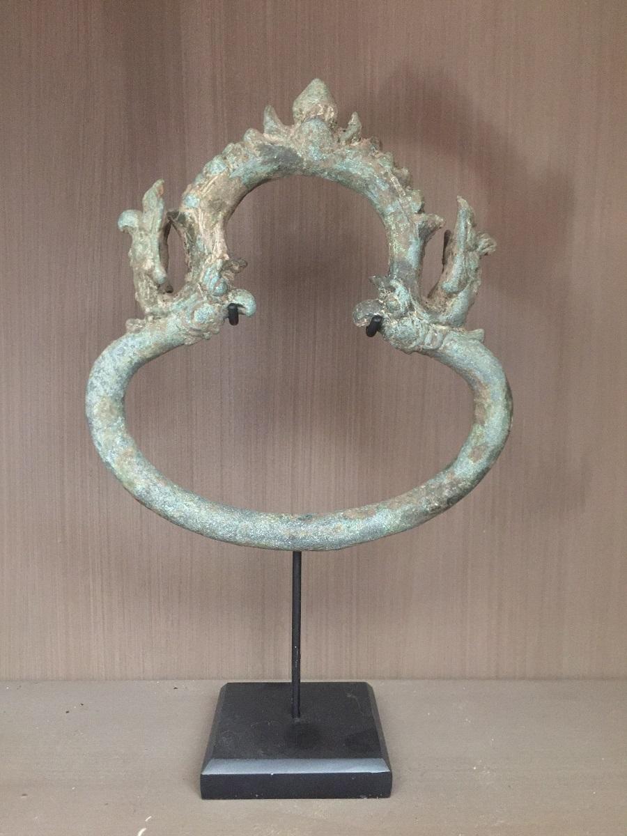 These Palanquin rings were used to slide a wooden pole trough which carried a litter. In this litter the aristocracy was transported and naturally the adornments of the carriage was meant to display the wealth and importance of their passengers.