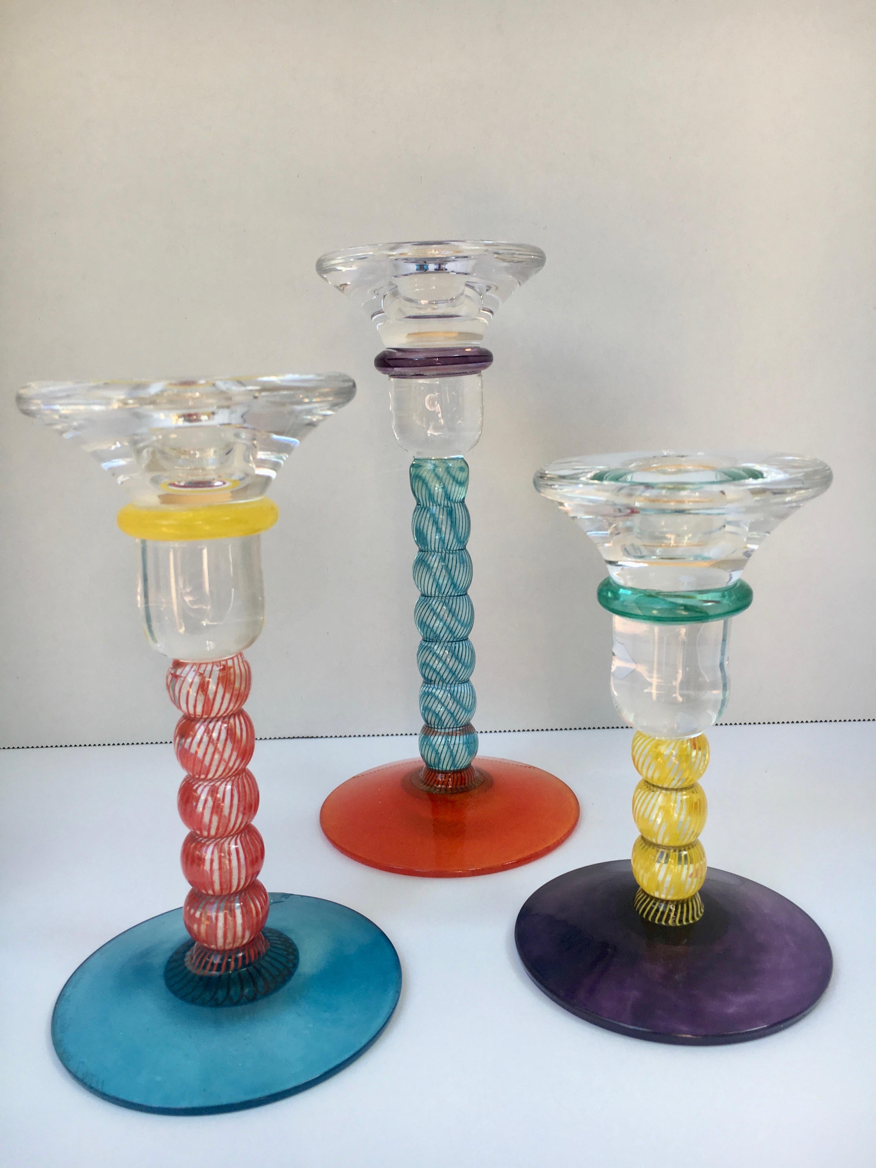 Set of 3 Kosta Boda candlesticks - Artfully designed Art glass, Signed on the underside

Measures: 3.75 diam. 
5.5