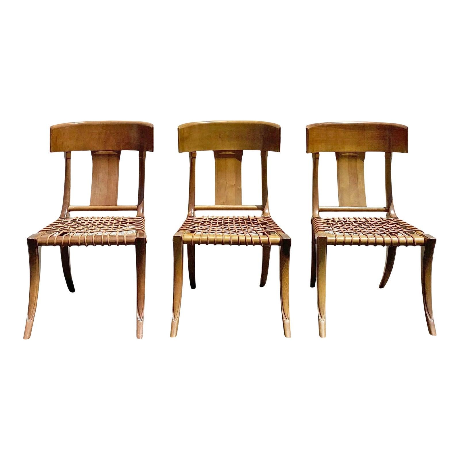 A set of three beautiful leather rope klismos dining chairs by Kreiss. One is a slightly different hue than the other two, as shown in the photos. Chairs are in wonderful condition. I have three cushions, but one is a different fabric than the other