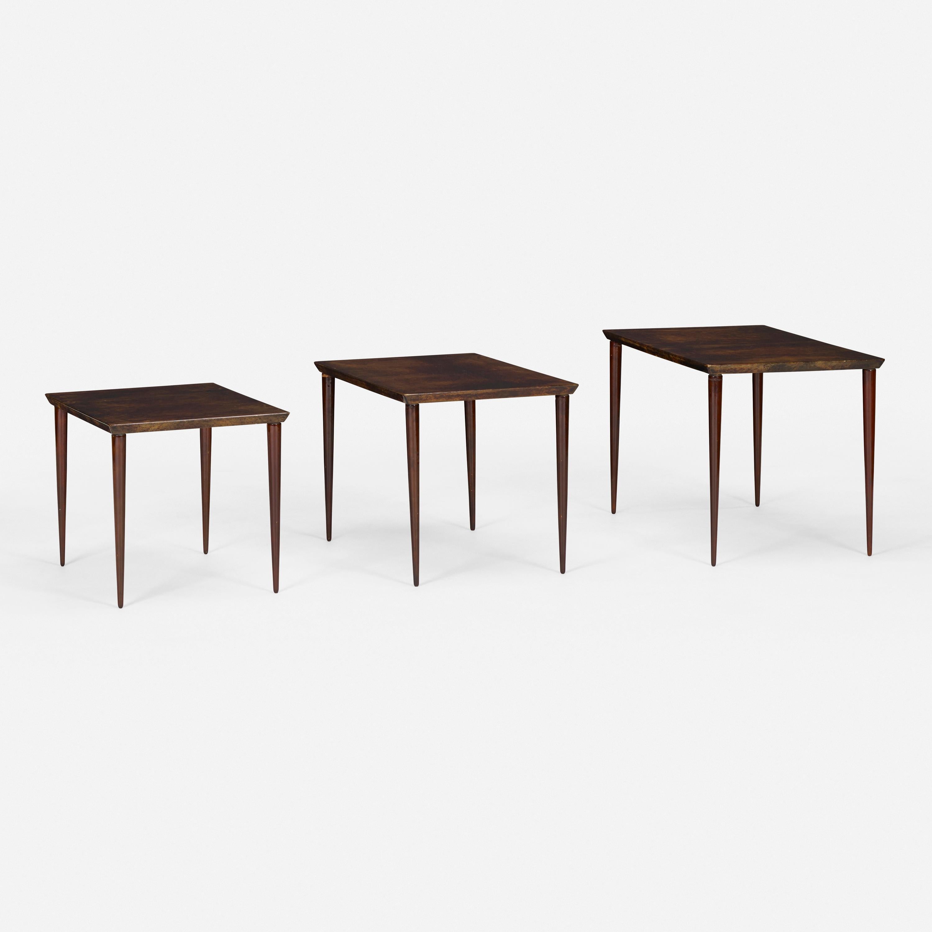 lacquered goatskin, mahogany nesting tables by Aldo Tura
smallest: 14 h × 19 w × 14½ d in 
largest: 16½ h × 26¾ w × 15½ d in
Paper studio label to underside of largest example ‘Tura Milano Italia’.