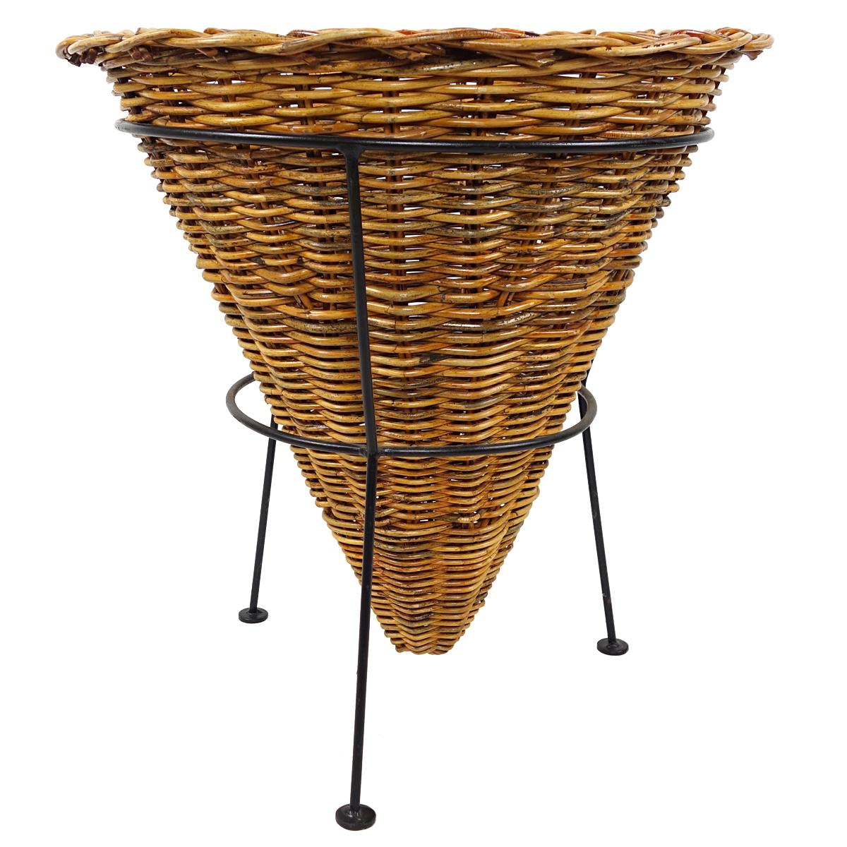 These lovely and very practical storage baskets were in service in the 1950s in a small department store in the Northern part of the Netherlands.

The baskets have been plaited by hand using willow toes. They sit on a black metal frame.

They