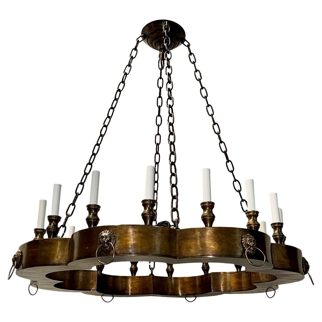 Paire de lustres en bronze patiné Vendu individuellement.
