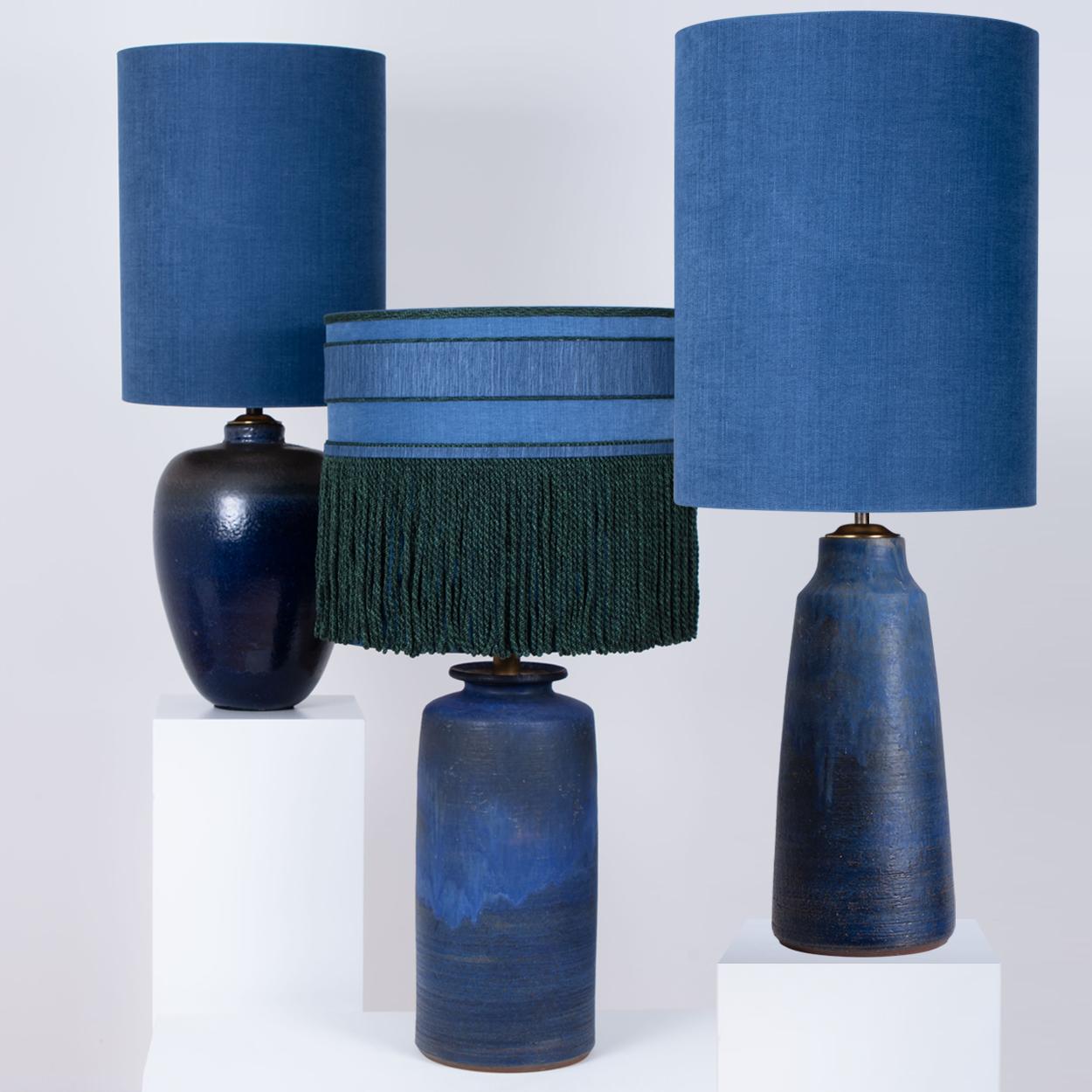 A set of 3 high-end ceramic table lamps, Denmark, 1960s. Sculptural pieces made of handmade ceramic in rich blue/grey tones, with a combination of dry and glazed finishes. With special new custom made blue silk lamp shades by René Houben. With warm