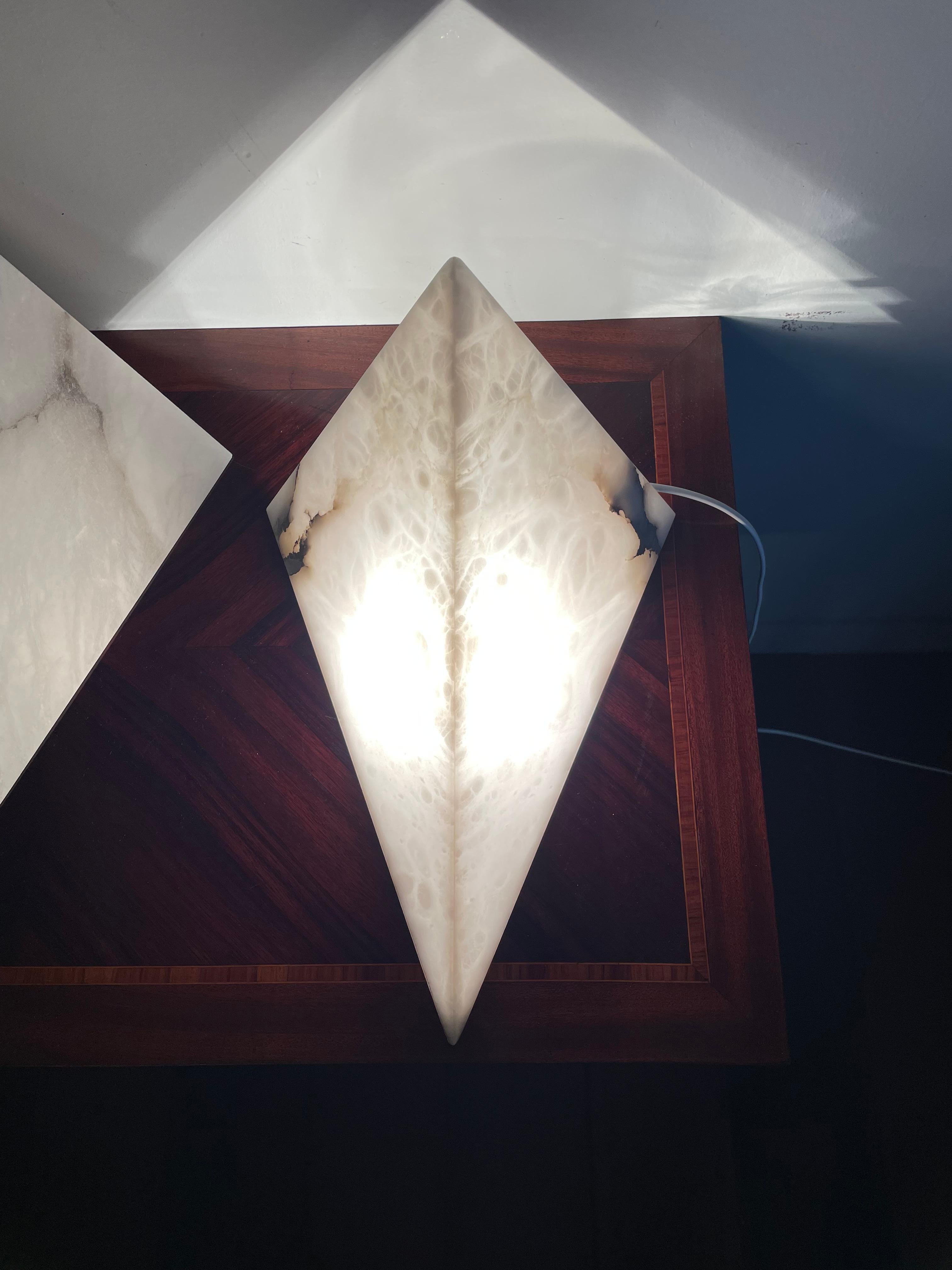 Large and stunning design, set of three alabaster wall lights.

Over the past 5 years we have seen our midcentury made and our antique alabaster fixtures become ever more popular both with interior designers and private buyers. Our alabaster