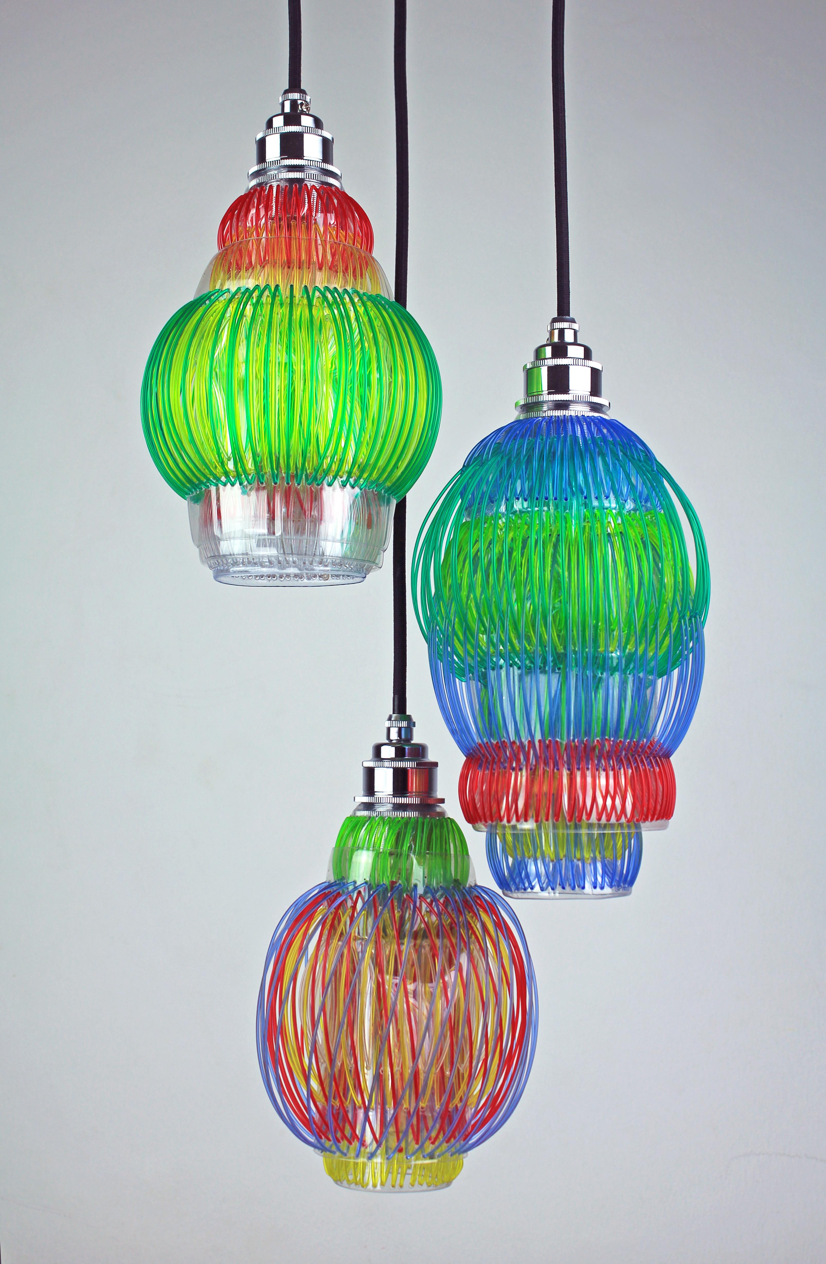 Set of 3 Lluvia pendant lamps by Anabella Georgi
Dimensions: 
Lamp 1: Diameter 30 x Height 14 cm 
Lamp 2: Diameter 26 x Height 14 cm 
Lamp 3: 25 x H 15 cm 
Materials: Recyclable Pet plastic bottles woven with rPET filament for 3D printers, Led
