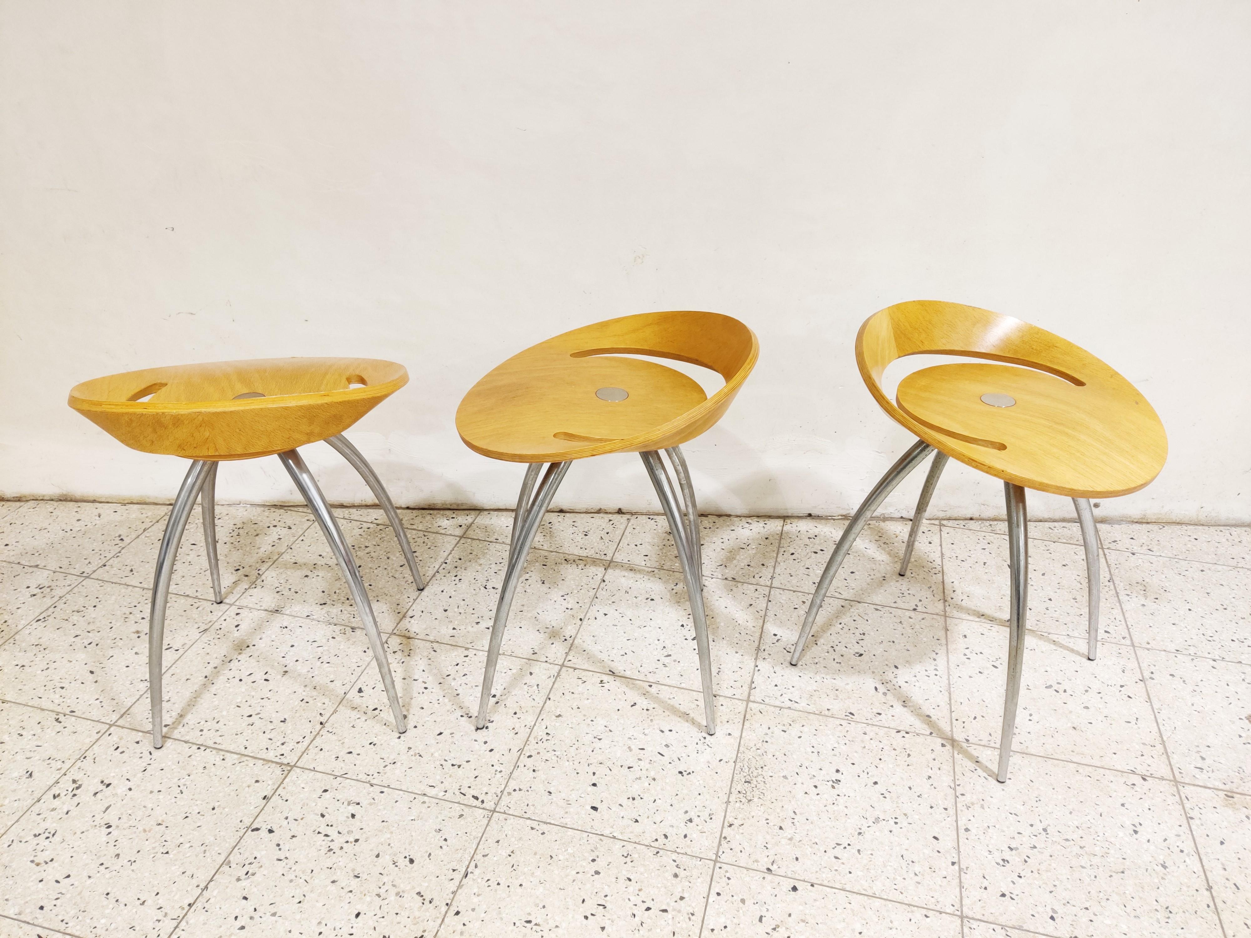 Beautifully designed plywood bar stools with chrome 'spider' shaped legs.

Timeless design.

The thick leather seats are attached with laces.

The open space in the stools allows to easily move them around.

Good condition, slight user