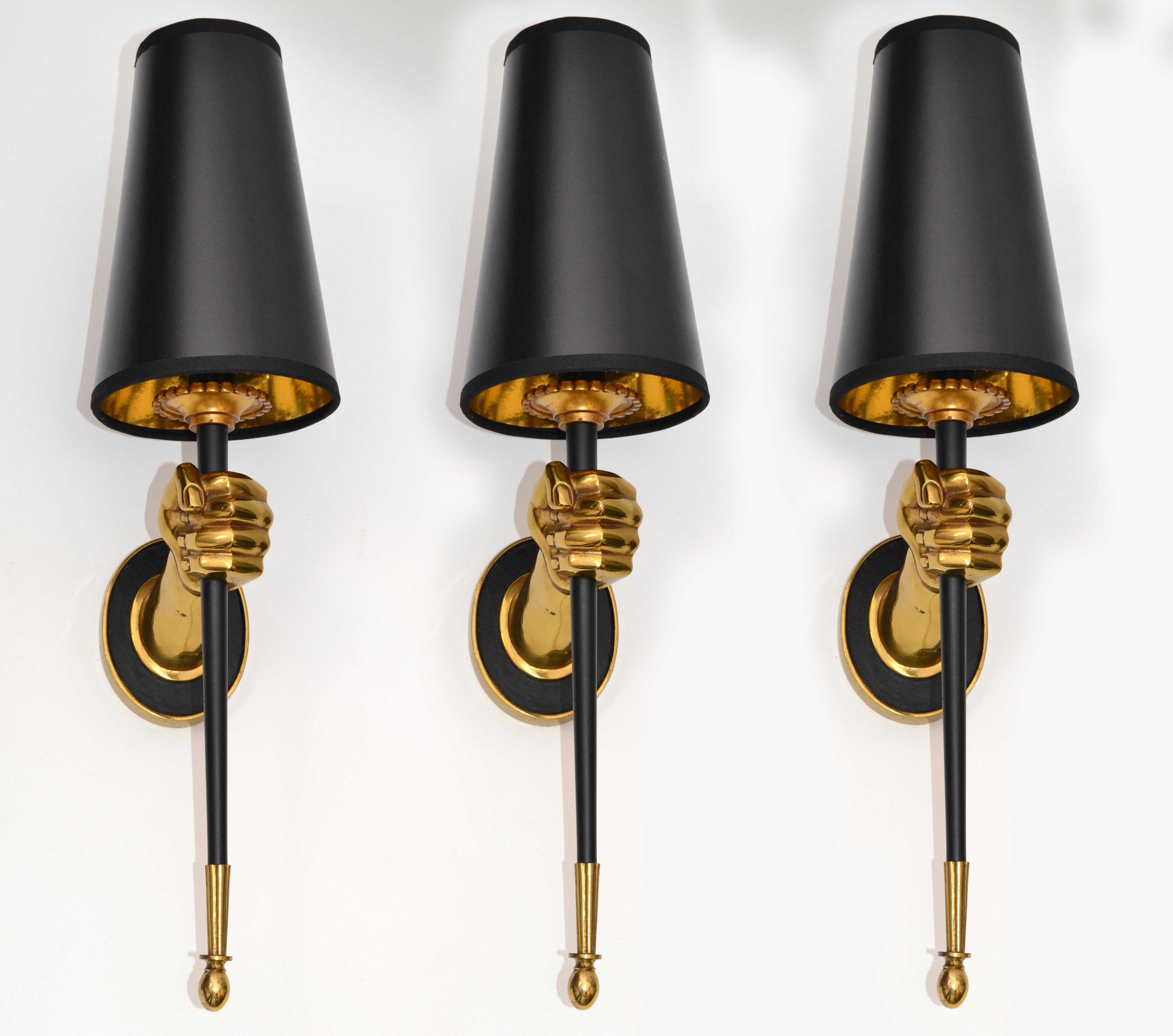 Impressive set 3 of sconces by Maison Jansen figuring a bronze hand holding a black lacquered torch.
One light, 60 watts max. US rewired.
Dimension without shade: 14 inches height, 3 1/4 inches width, 6 inches depth.
Projection back plate 4.5 H,