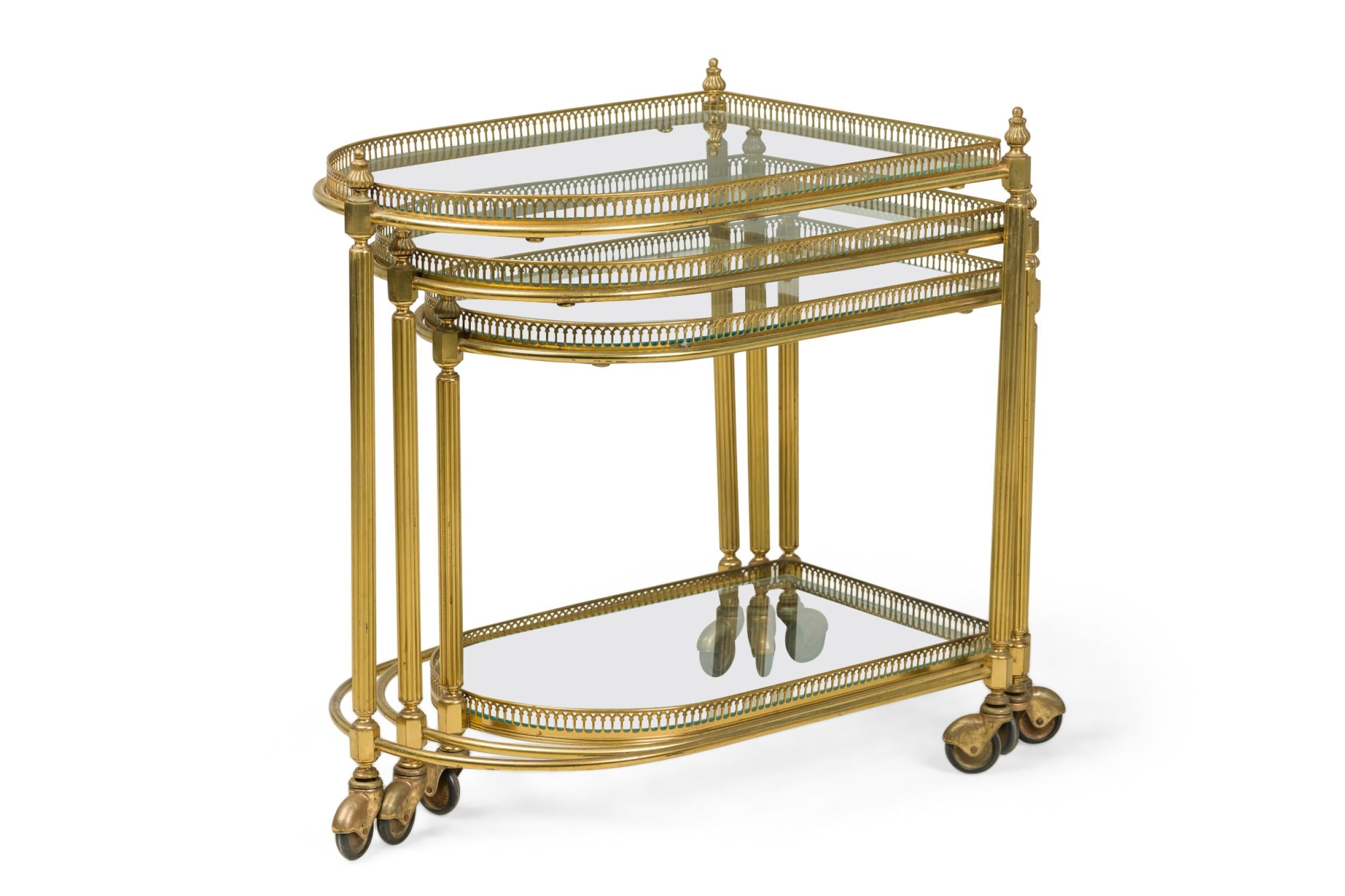 Mid-Century Modern Set of 3 Maison Jansen Mid-Century French Brass Rolling Nesting Tables For Sale