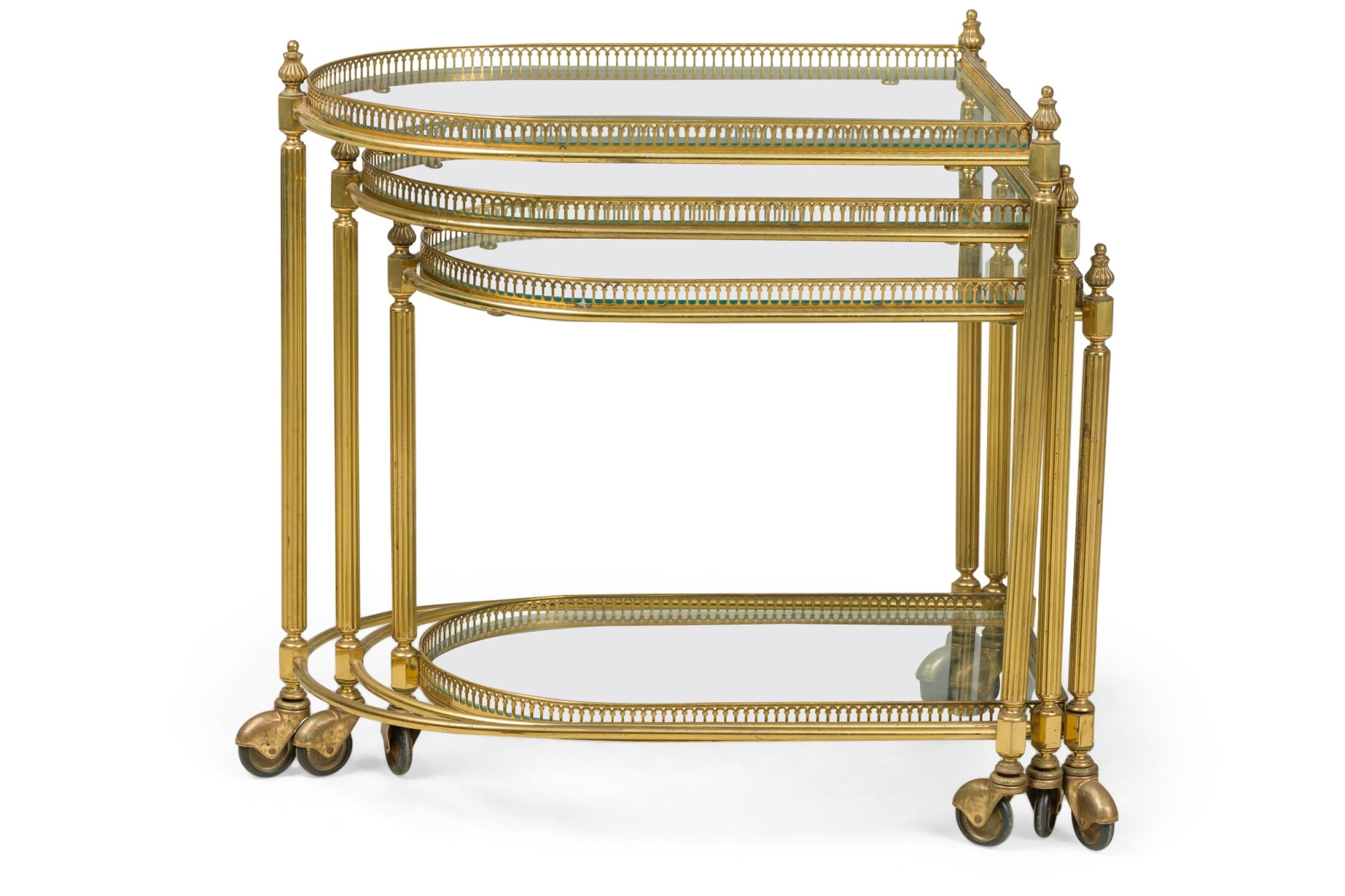 Hand-Crafted Set of 3 Maison Jansen Mid-Century French Brass Rolling Nesting Tables For Sale
