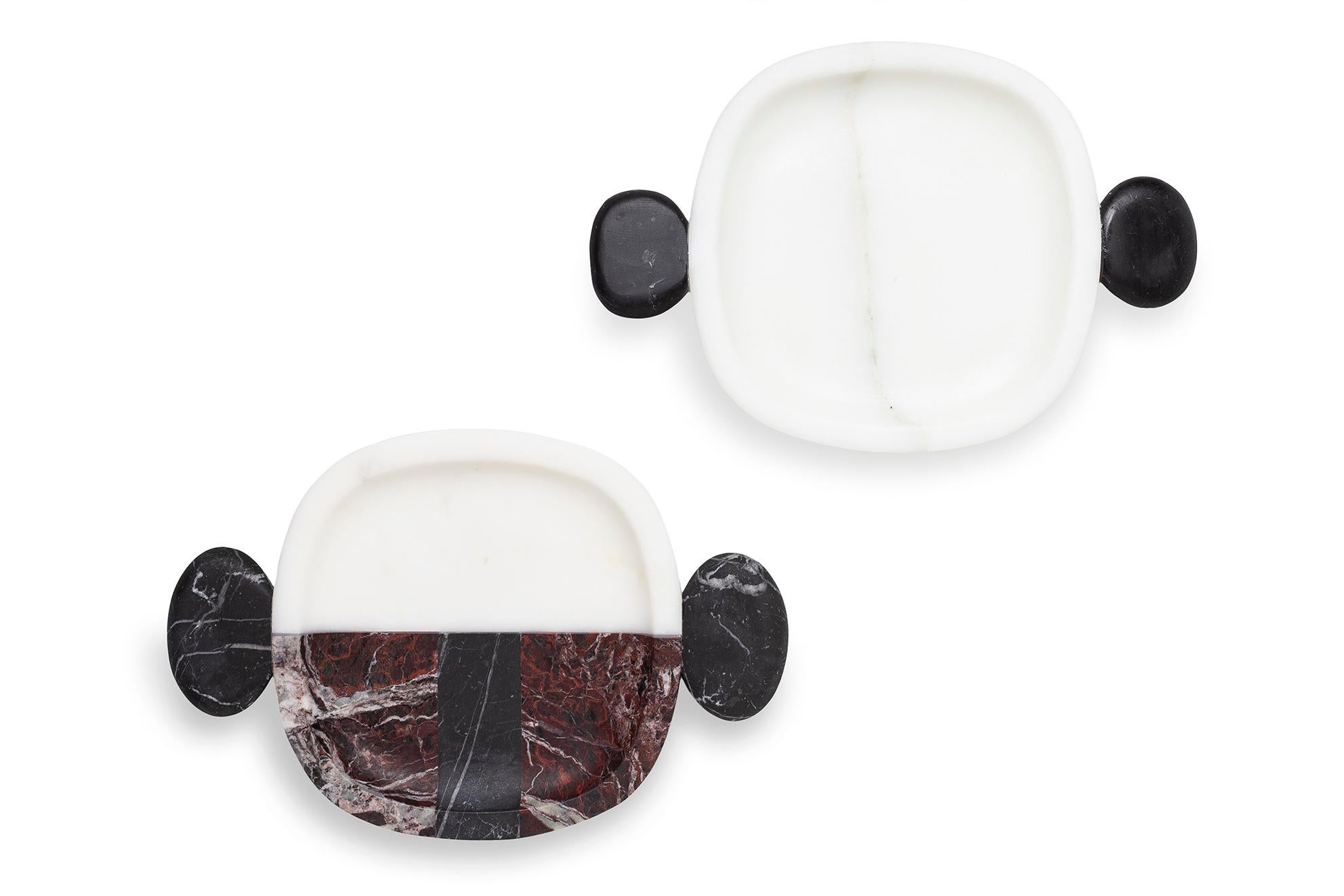 Set of 3 marble small plates and tray by Matteo Cibic
Dimensions: Plates: 22.5 x 15 x 2 cm
 Tray: 40 x 29 x 4 cm
Materials: Bianco michelangelo, nero marquinia 
 Rosso Levanto

Please note that the Cibic pieces with “ears” or tray handles are