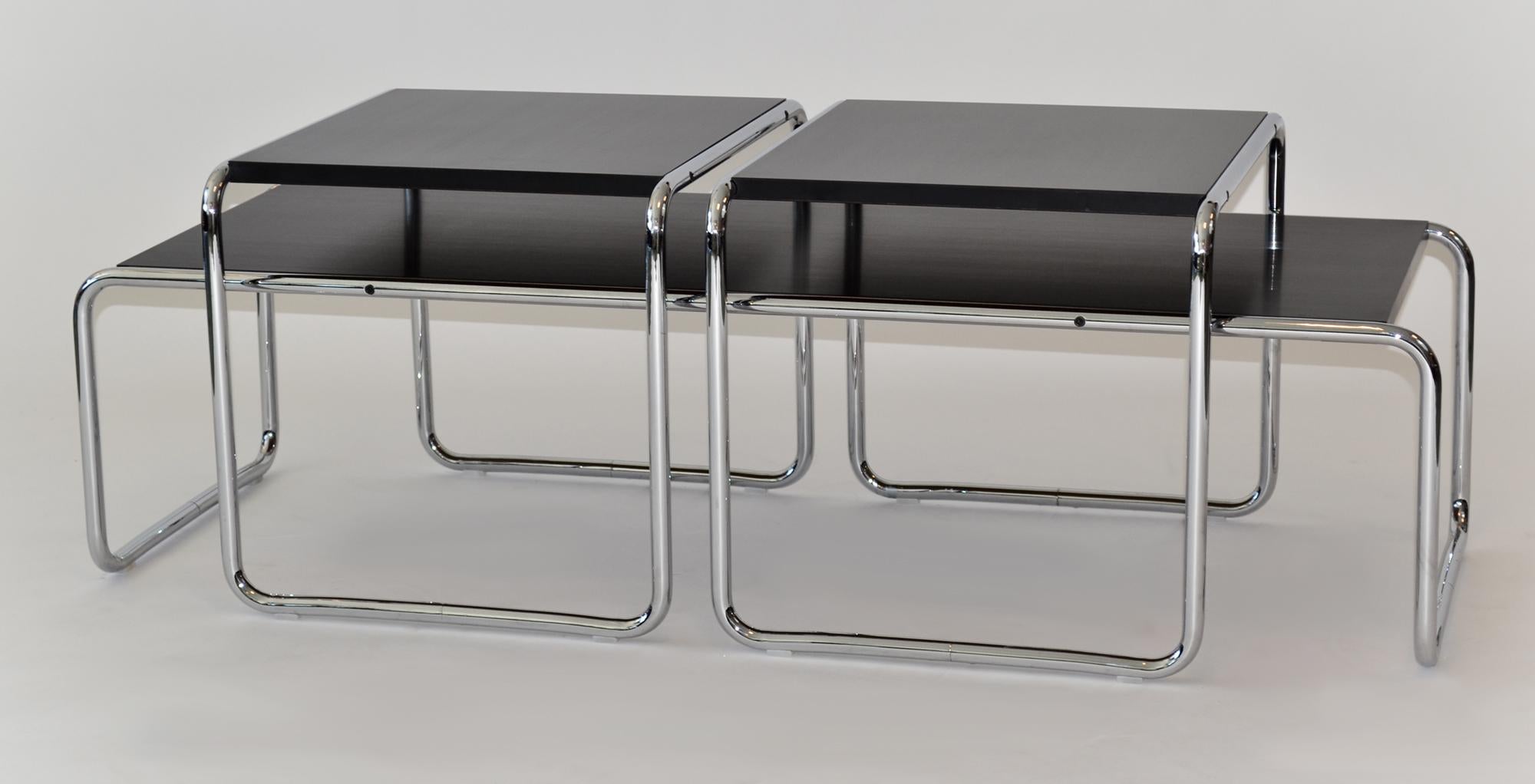 Set of 3 Marcel Breuer Laccio Coffee and Side Tables Black Chrome Knoll Studio
This exquisite set, comprised of a coffee table and a pair of side tables, showcases Marcel Breuer’s iconic Laccio design. Renowned for his minimalist and Bauhaus
