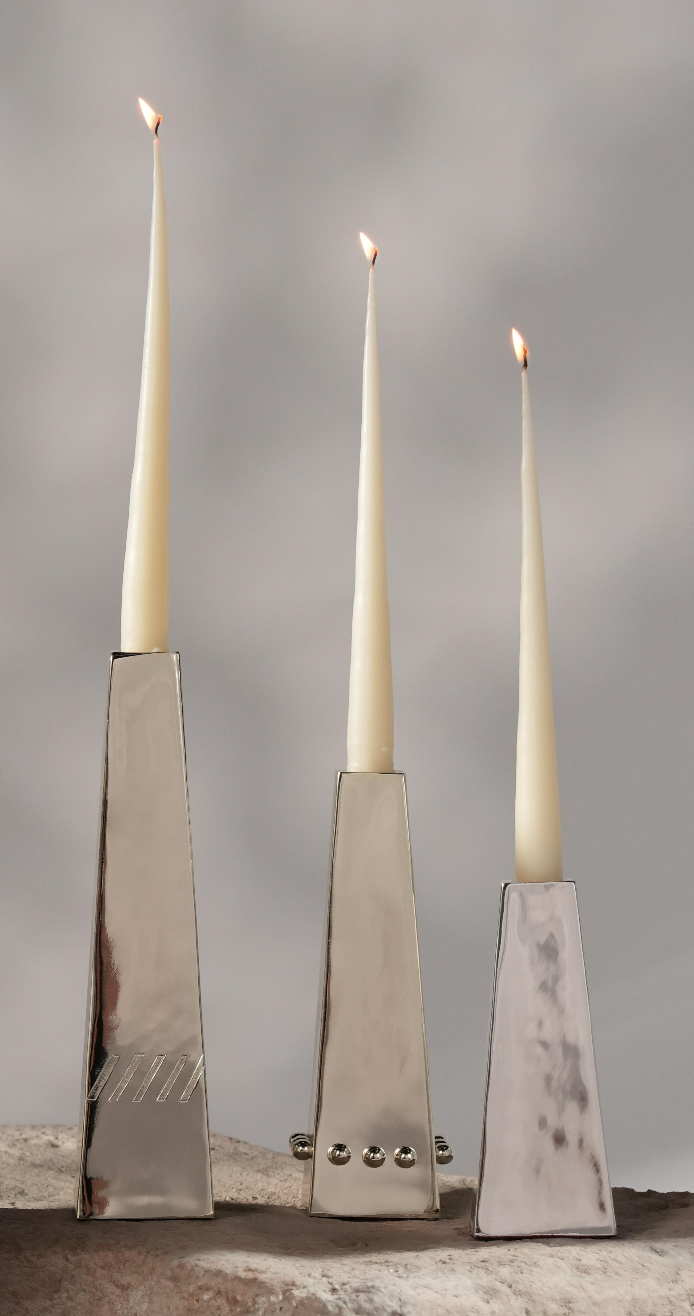 Set Of 3 Marri Candleholders in Silver-Plated Brass by Marau
Dimensions: Small: D 6 x W 6 x H 15 cm.
Medium: D 6 x W 6 x H 20 cm.
Large: D 6 x W 6 x H 25 cm.
Materials: Silver-plated brass.

These candleholders are also sold separately. Please