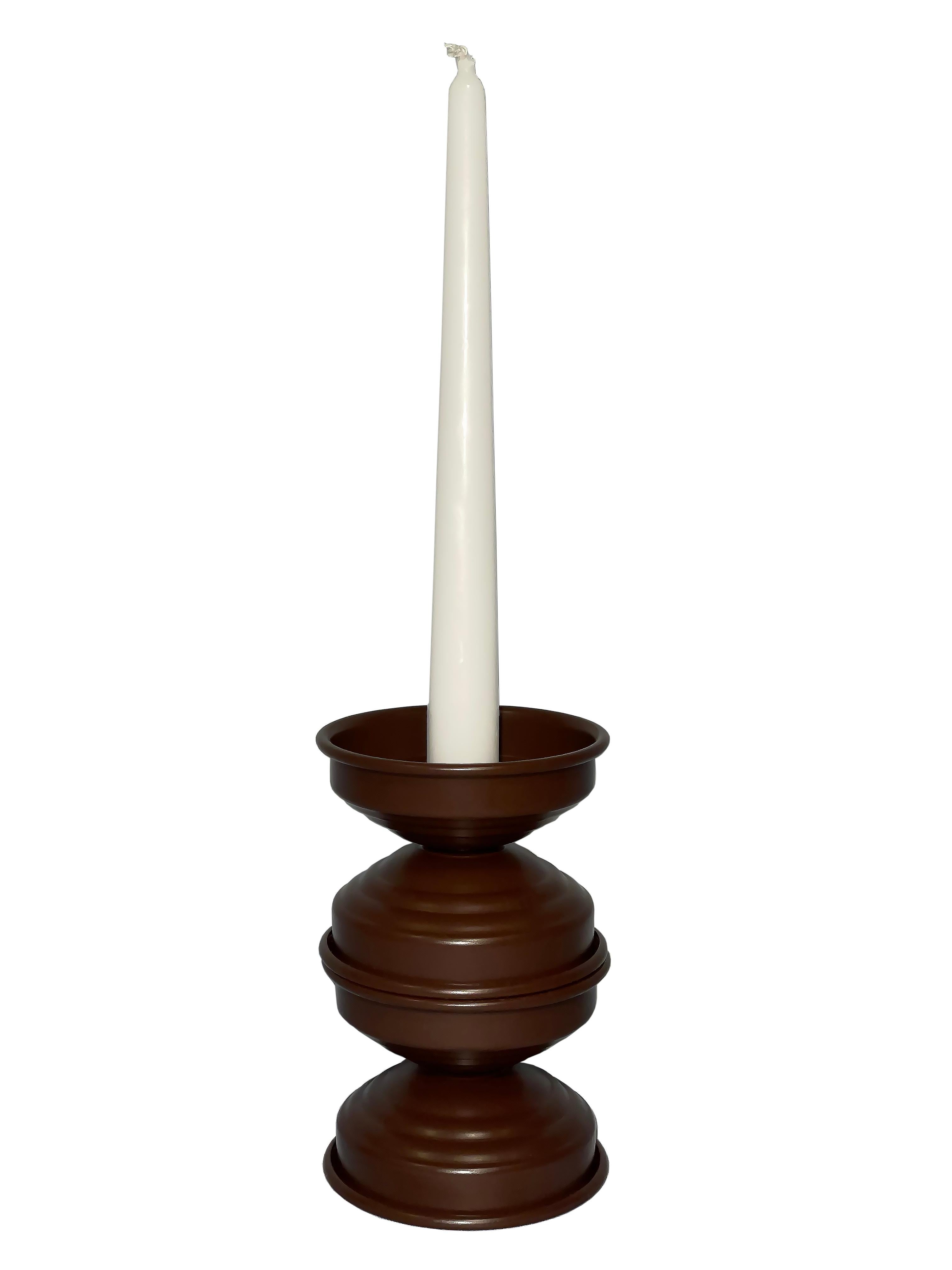 Handcrafted in Italy, this set of 3 candlesticks features a sculptural minimalist design with a rich, matte chocolate finish. Made from hand-painted aluminum, each piece has a velvety, non-reflective surface that lends warmth and understated