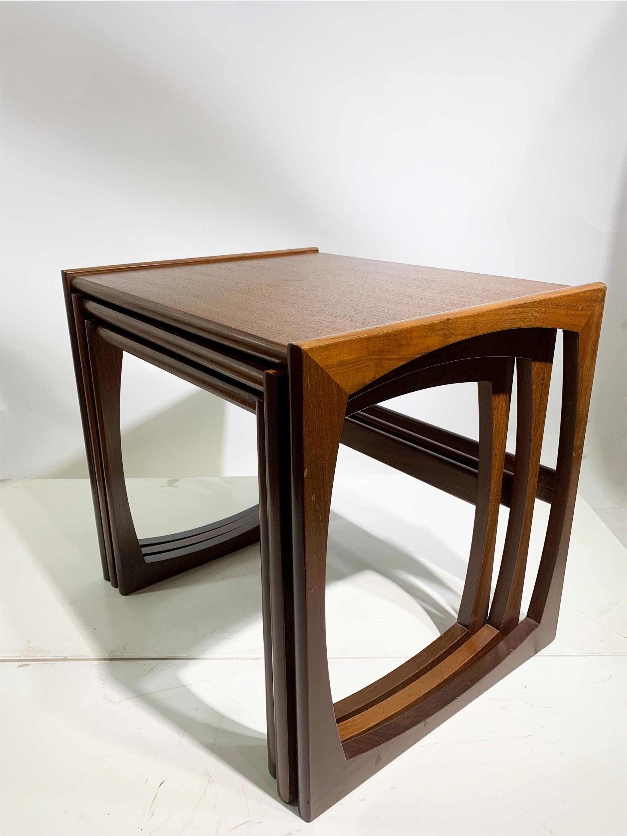 Featuring a breathtaking and emblematic design, these teak nesting tables are a remarkable creation by G Plan. Originating from the esteemed Quadrille range, these tables were meticulously crafted in England during the 1960s.

The craftsmanship of